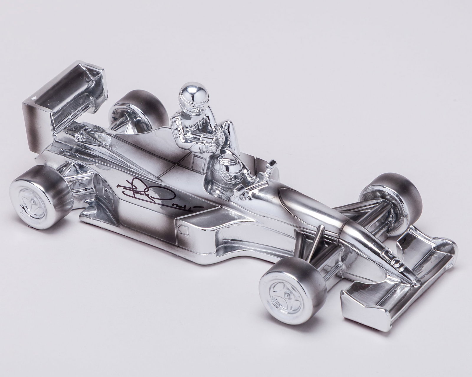 Nigel Mansell Signed Chromed Sculpture 'Taxi For Senna' 1991 Williams Renault FW14: Nigel Mansell Signed Chromed Sculpture 'Taxi For Senna' 1991 Williams Renault FW14.?This limited edition chromed sculpture has been commissioned to celebrate one of the most memorable moments in Formu