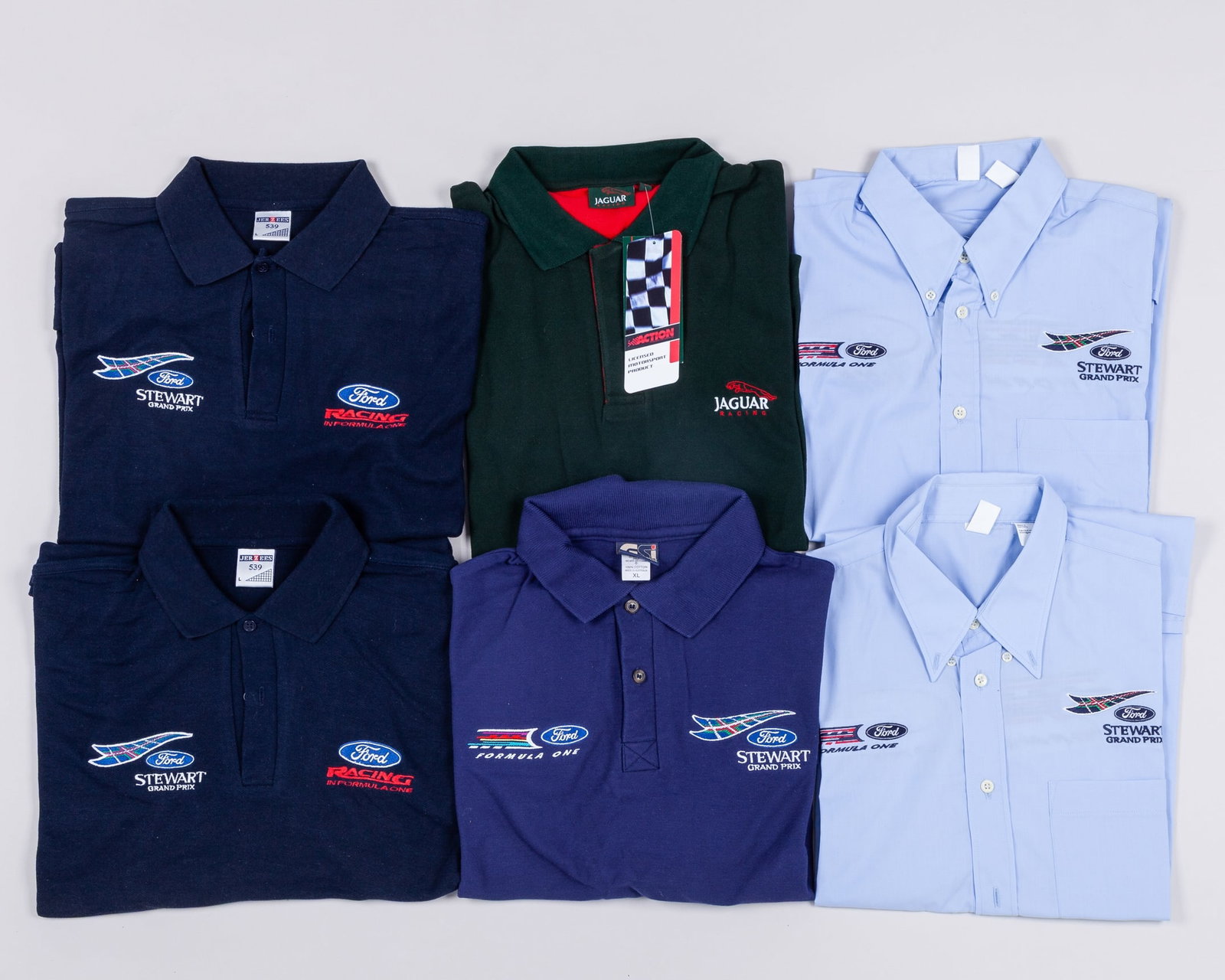 Jaguar Racing & Stewart Grand Prix Clothing: Jaguar Racing & Stewart Grand Prix Clothing.The clothing collection includes the below:Jaguar Racing polo shirt (New) - size medium.2 x Stewart Grand Prix shirts.2 x Stewart Grand Prix polo shirts - b