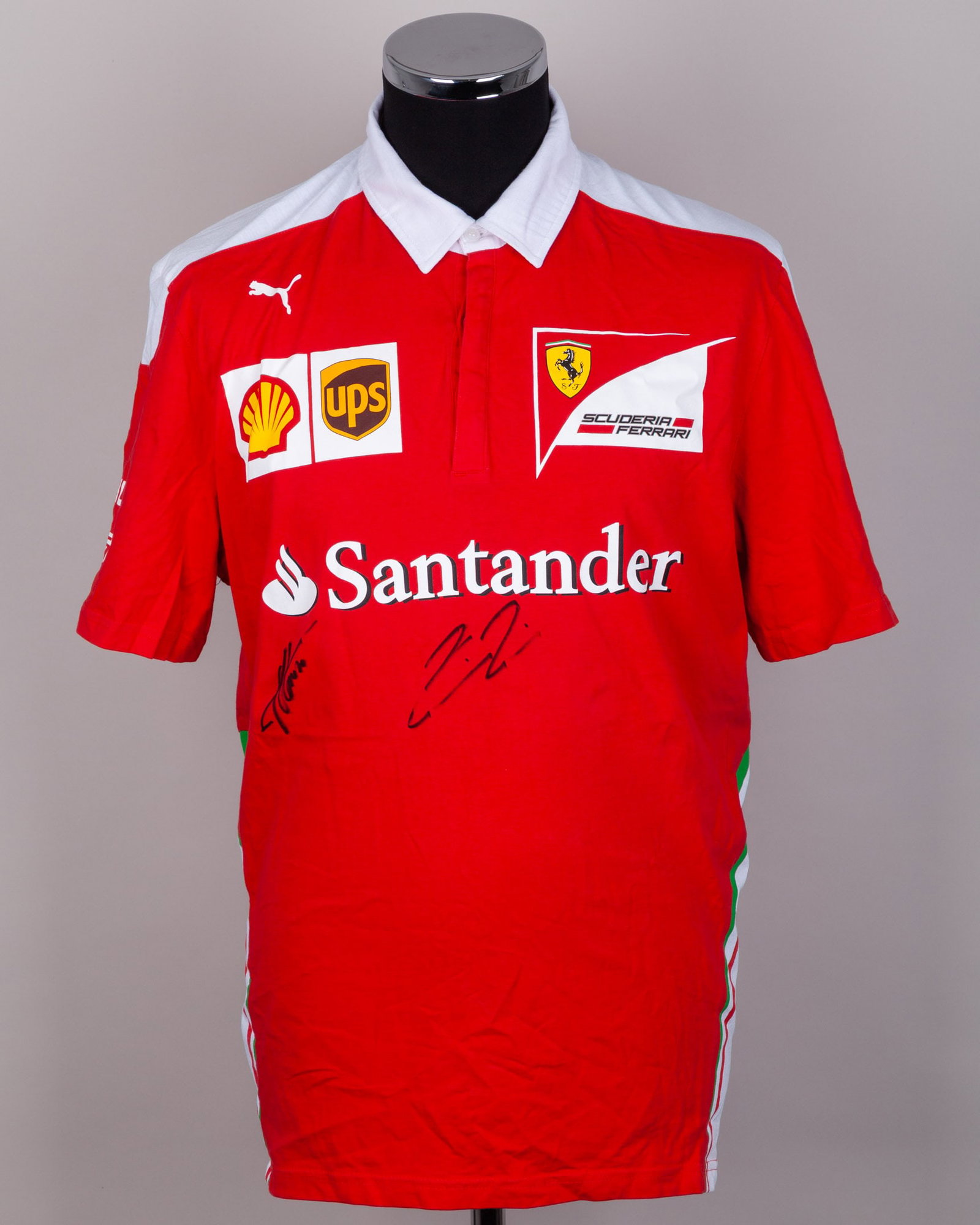 Fernando Alonso & Kimi Raikkonen Signed Ferrari Polo Shirt: Fernando Alonso & Kimi Raikkonen Signed Ferrari Polo Shirt.This Ferrari polo shirt is personally signed by F1 World Champions, Fernando Alonso and Kimi Raikkonen.The size is XL.