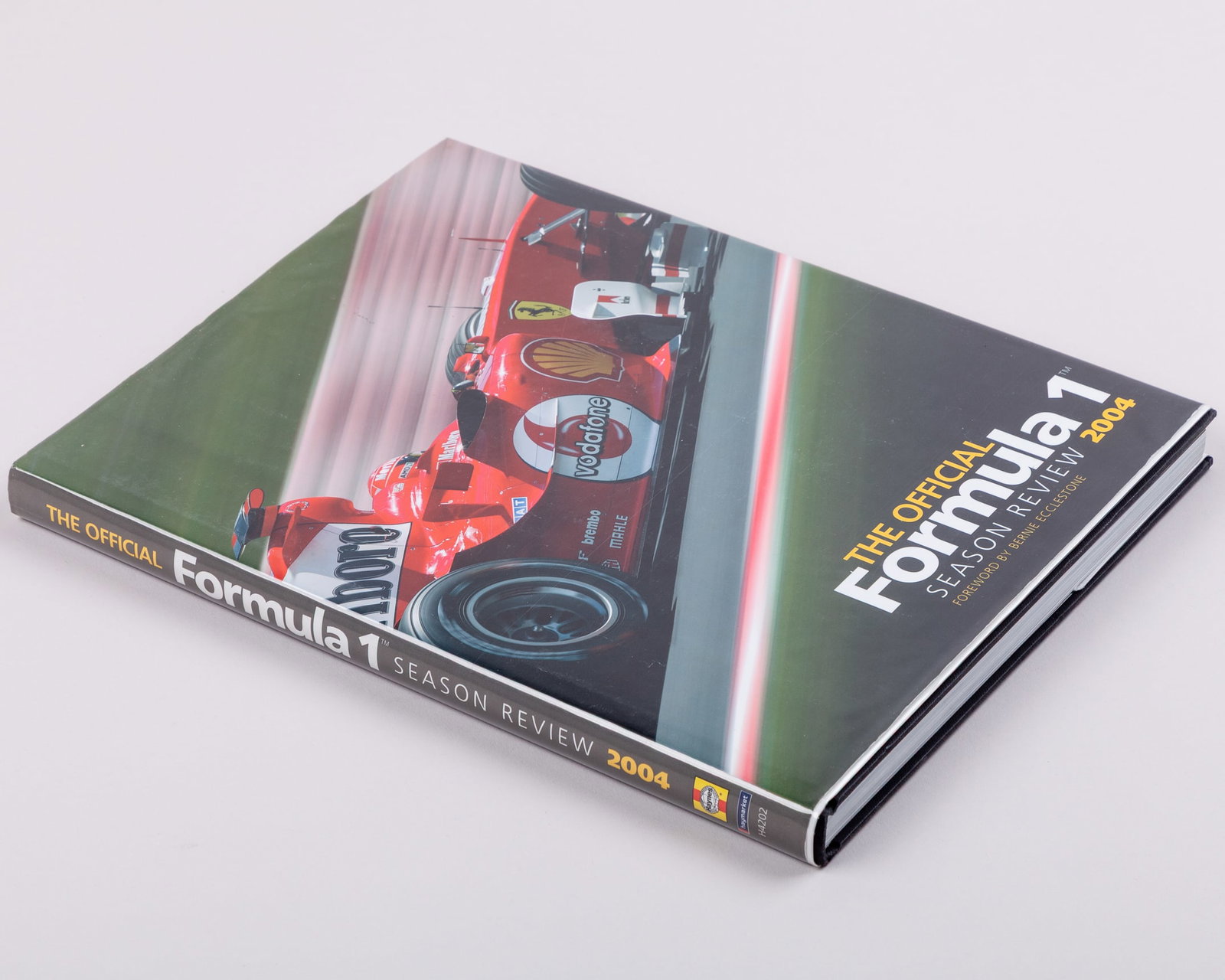 Formula One 2004 Official Season Review Signed Book: Formula One 2004 Official Season Review Signed Book.This official season review book includes 39 signatures including Michael Schumacher, Kimi Raikkonen, Fernando Alonso, Jenson Button, and many more.