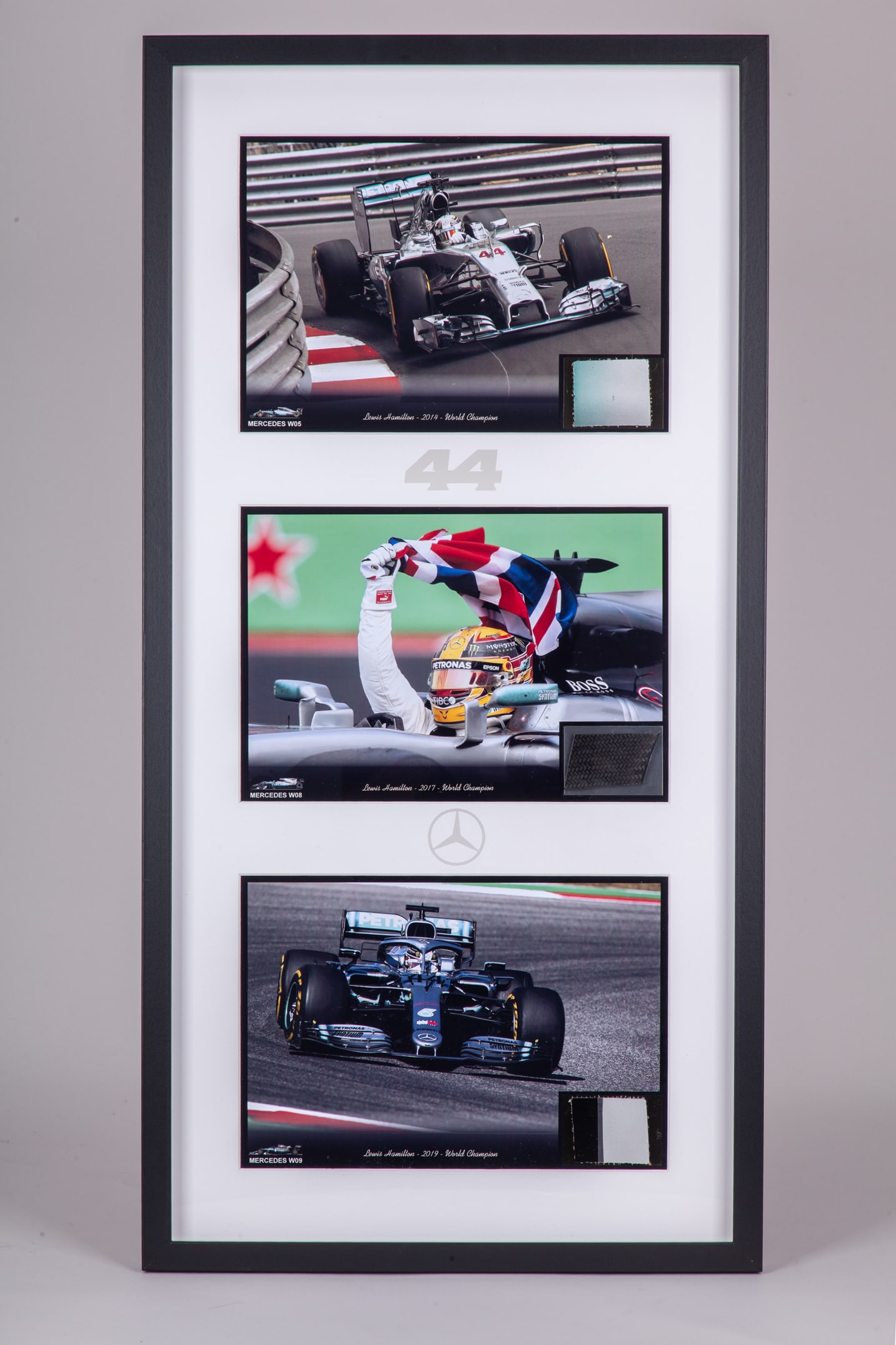 Lewis Hamilton Framed Mercedes World Championship Car Parts with Photo's: Lewis Hamilton Framed Mercedes World Championship Car Parts with Photo's. This framed set includes car parts from Lewis' Championship winning seasons 2014, 2017, and 2019. Accompanied with photo's fro