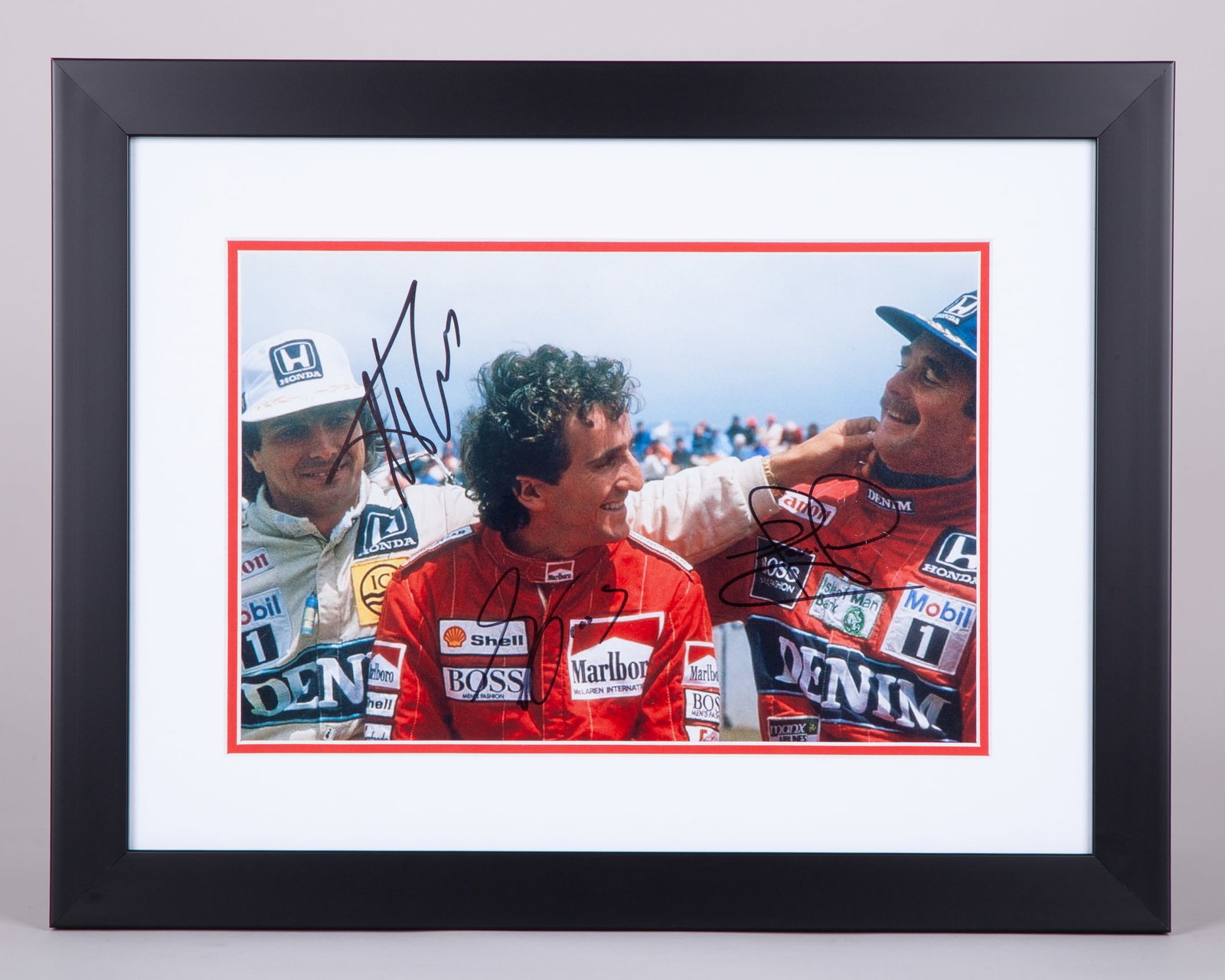 “Laughing friends” Framed Print Signed by Nigel Mansell, Alain Prost & Nelson Piquet: “Laughing friends” Framed Print Signed by Nigel Mansell, Alain Prost & Nelson Piquet. This print is personally signed by F1 World Champions Nigel Mansell, Alain Prost, and Nelson Piquet. The f