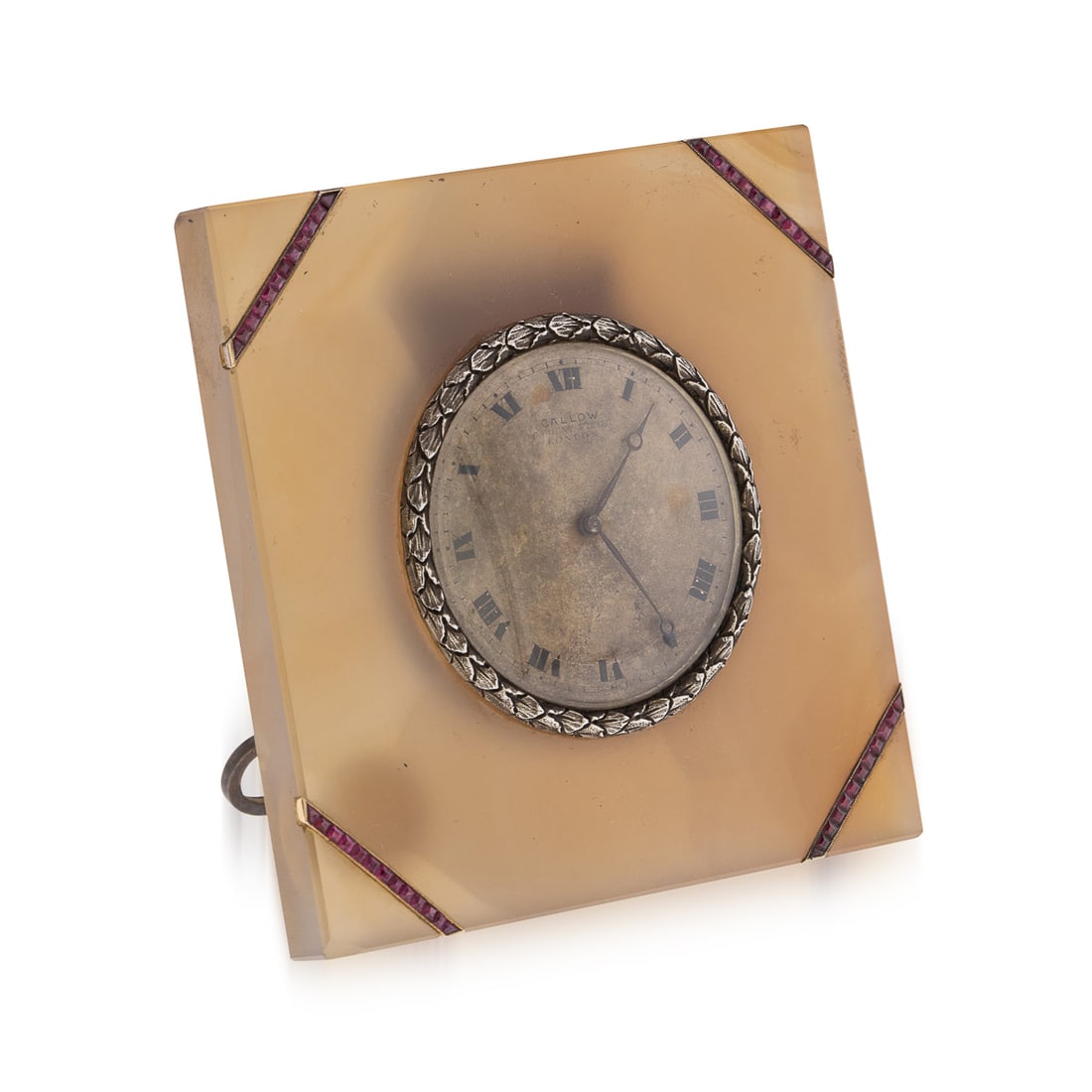 ANTIQUE 20thC SOLID SILVER & AGATE CLOCK, CALLOW OF MOUNT STREET, LONDON c.1910: Antique early-20th Century Edwardian travel clock featuring a solid silver inset clock with ruby mounted decorations on translucent agate body. The clock has a signed easel on the back and is in