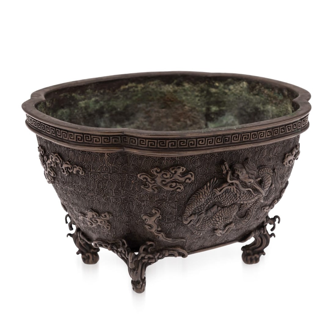 ANTIQUE 19thC JAPANESE BRONZE VESSEL IN THE STYLE OF THE 17thC EDO PERIOD: Antique 19th Century Japanese bronze vessel, Edo period. Of lobed form, raised on four feet shaped as waves, the body decorated in high relief with two coiled dragons among clouds against a densely ca