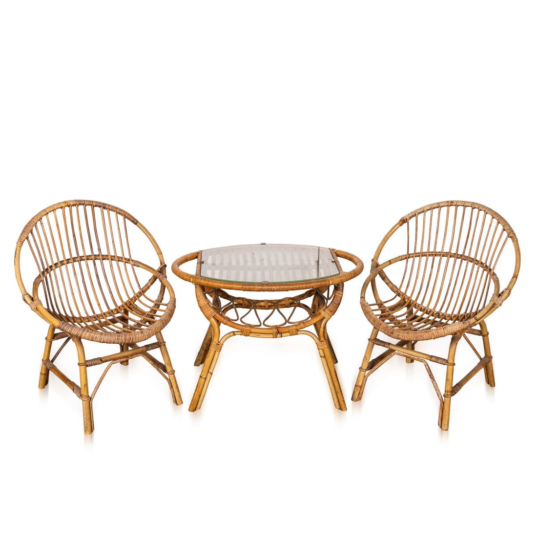 VINTAGE 20thC ITALIAN BAMBOO CONSERVATORY SUITE c.1970: A charming Italian bamboo conservatory suite dating from the 1970s, comprising a matched pair of rounded lounge chairs and a coordinating oval coffee table. Crafted from warm honey-toned bamboo with t