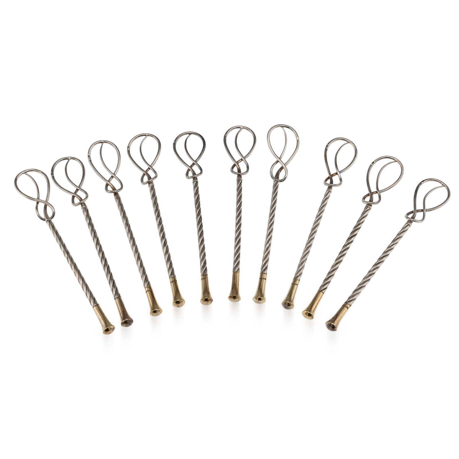 VINTAGE 20thC SET OF 10 HERMÈS GILT SOLID SILVER GILT CHAMPAGNE STIRRERS, FRANCE: A 20th Century set of 10 French gilt solid silver champagne stirrers by Hermès, Paris. The set includes ten stirrers. Designed in a twisted rope Art Deco style, these stirrers make a stylish