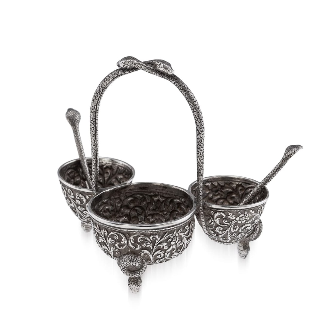 ANTIQUE 19thC INDIAN SOLID SILVER CONDIMENT SET, OOMERSI MAWJI, BHUJ c.1890: Antique 19th century Indian solid silver condiment set, intricately decorated throughout with fine repoussé work against a finely matted ground. The entire surface is richly adorned with flowing