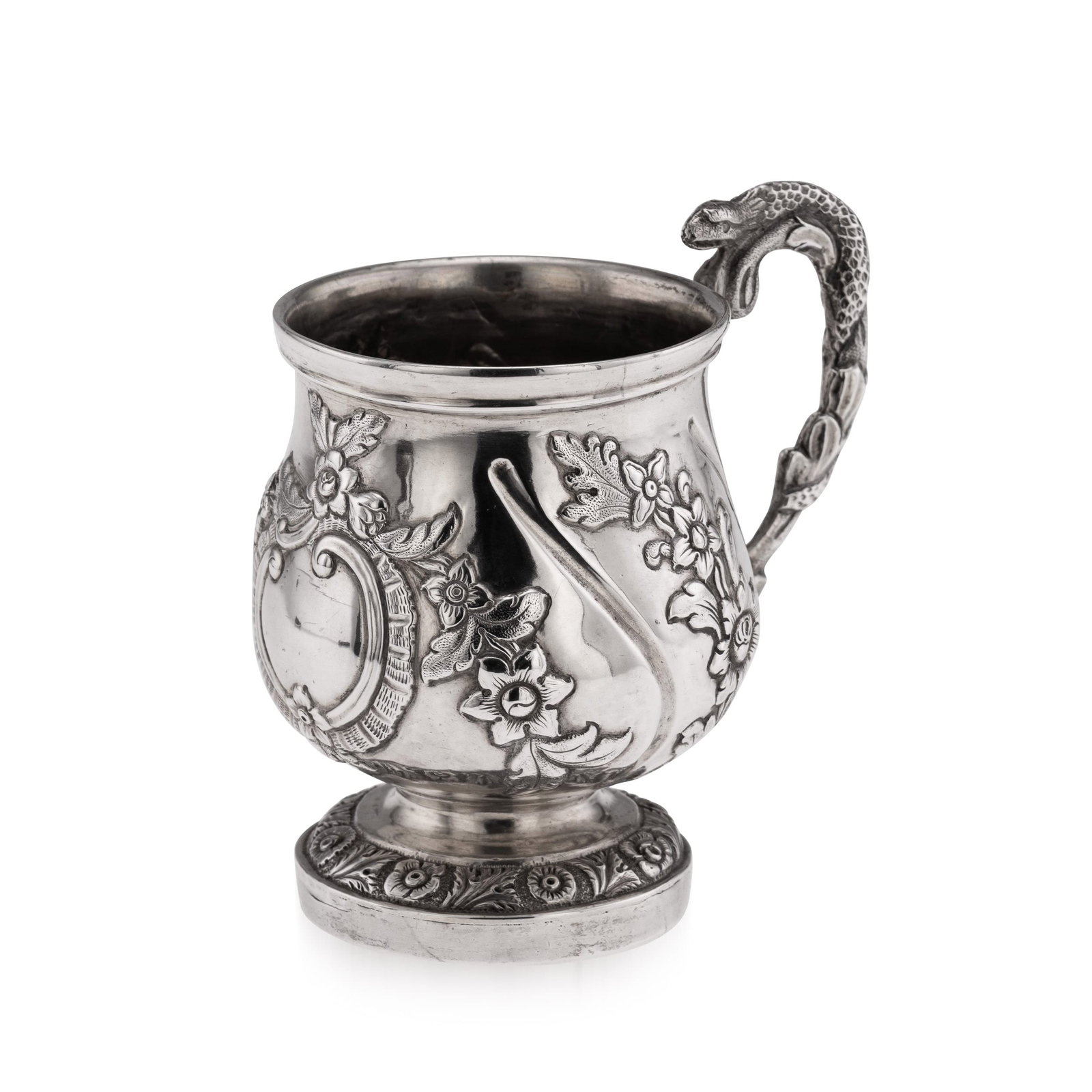 ANTIQUE 19thC INDIAN COLONIAL SOLID SILVER CHRISTENING MUG c.1860: Antique 19th Century Indian colonial silver christening mug, of rounded bellied form with wrythen fluting, decorated with chased floral work and a central cartouche. The scroll handle is entwined