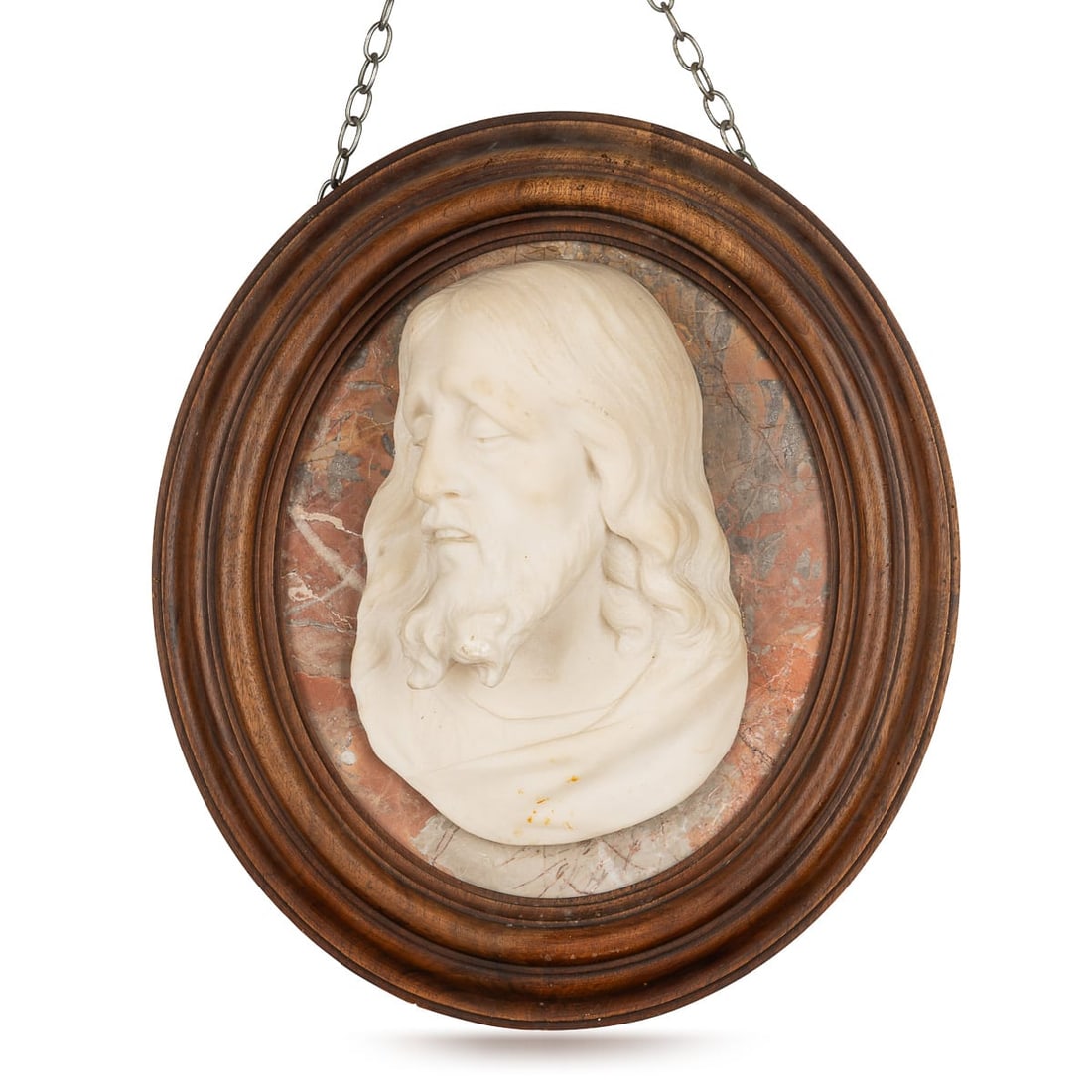 ANTIQUE 20thC ITALIAN CARVED MARBLE RELIEF OF CHRIST IN AN OVAL WOOD FRAME: Antique 20th Century Italian carved marble relief depicting Jesus Christ, finely modelled in profile with flowing hair and beard. The pale marble portrait is mounted against a contrasting variegated