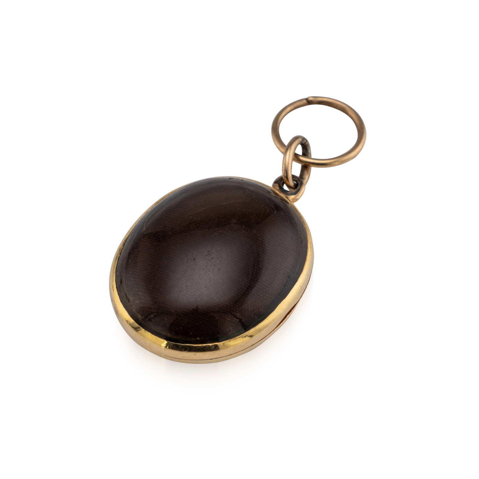 ANTIQUE 19thC VICTORIAN 14K GOLD OVAL PORTRAIT LOCKET: Antique 19th Century Victorian 14K gold oval locket, featuring a clear cabuchon in a simple gold bezel. The hinged locket opens to reveal a period photographic portrait of a formally dressed gentleman
