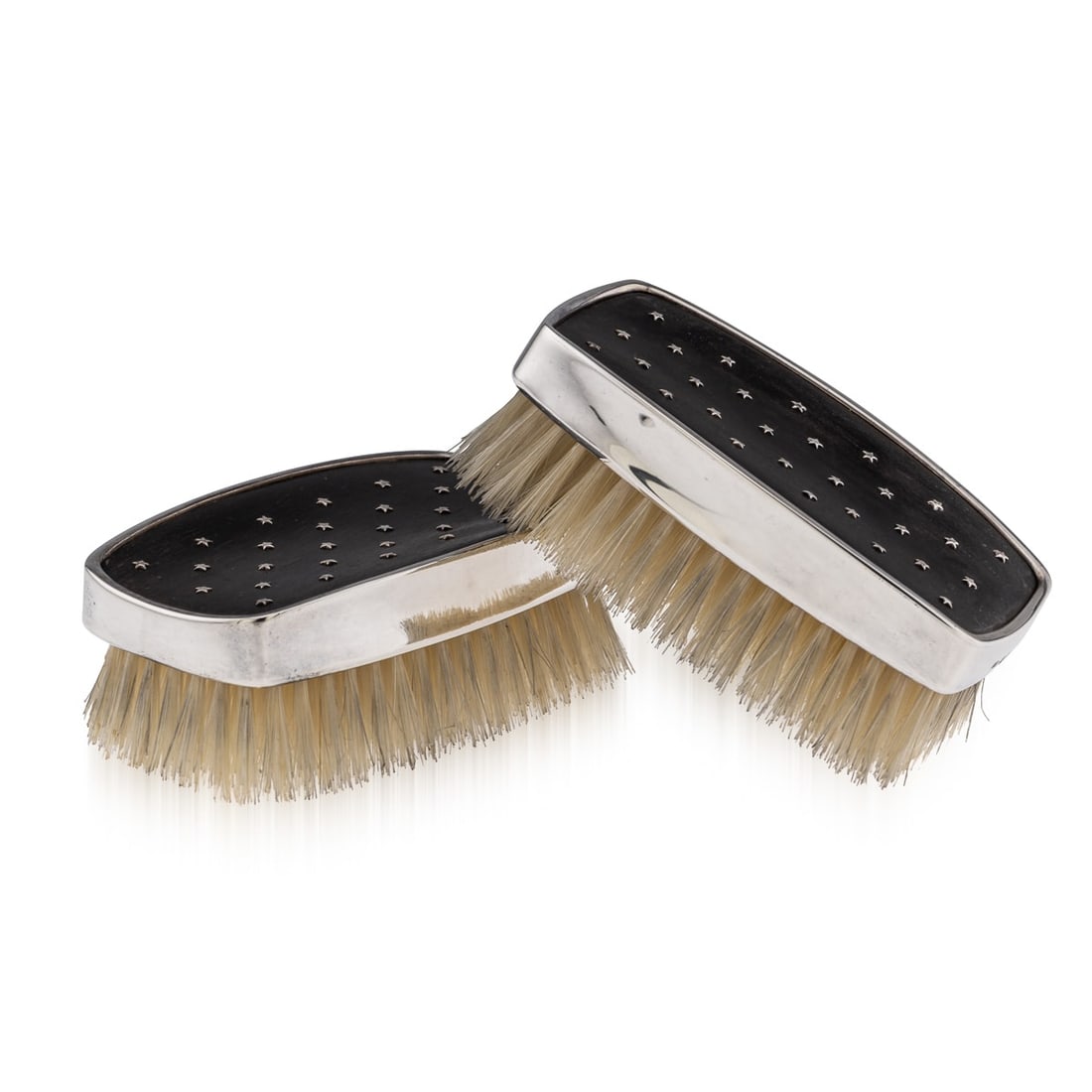 VINTAGE 20thC PAIR OF SOLID SILVER CLOTHES BRUSHES, LESLIE DURBIN c.1957: A pair of mid 20th Century English solid silver clothes brushes. The brushes feature a wooden handle which has a solid silver edge band. Throughout the top of the handle, there are small silver star