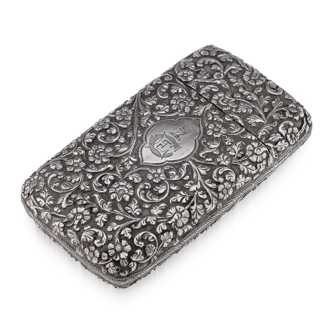 ANTIQUE 19thC INDIAN KUTCH SOLID SILVER CIGAR CASE c.1880: Antique 19th Century Indian Kutch hand-crafted solid silver cigar case. Of rectangular form with rounded edges, finely chased throughout with scrolling leaves and floral patterns on a finely tooled
