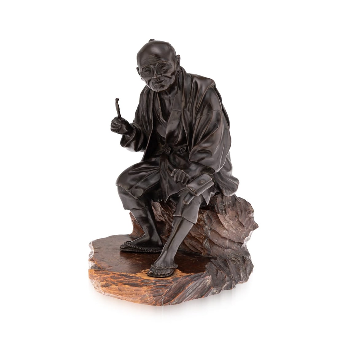 ANTIQUE 19thC JAPANESE MEIJI PERIOD BRONZE OKIMONO C.1890: Antique 19th Century Japanese Meiji period bronze okimono. The elderly man is seated at rest on a removable wooden bench and separate wood stand, his left leg outstretched, holding over his knee in