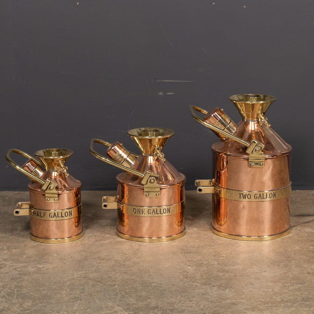 VINTAGE 20thC ENGLISH SET OF THREE POLISHED CHECKPUMP PETROL CANISTERS c.1965 - 4