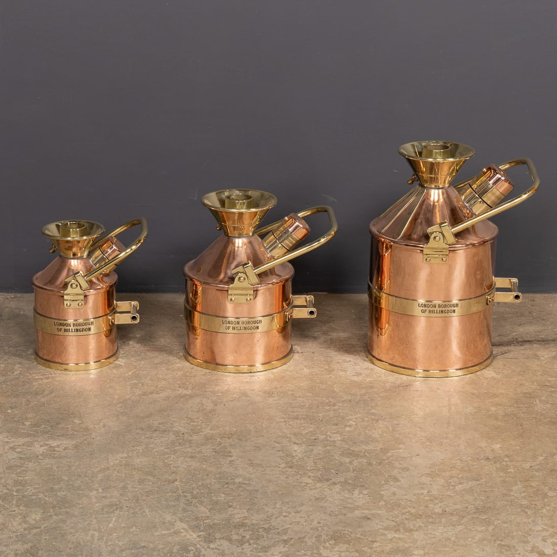 VINTAGE 20thC ENGLISH SET OF THREE POLISHED CHECKPUMP PETROL CANISTERS c.1965 - 7