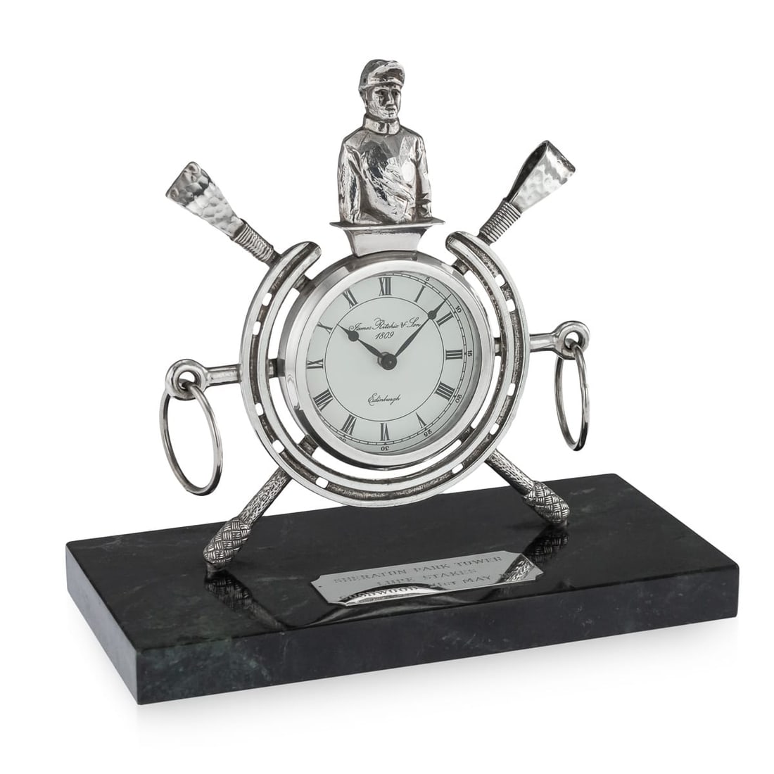 UNUSUAL 20thC SOLID SILVER HORSE RACING CLOCK, EDINBURGH c.1983: Unusual 20th Century solid silver clock on green marble base, the clock set between a horse-shoe and mounted with a jockey, stirrups and riding crops. The clock is in fully working order and base