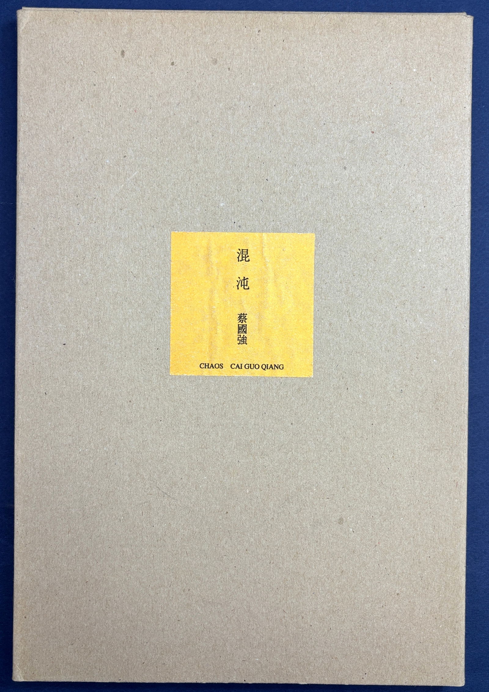 Chaos - Cai Guo Qiang, 1994 exhibition catalog, Setagaya Museum, Tokyo. Important Chinese artist.: Osaka: Masatoshi Tatsumi / Nomart Editions, 1994. 12 x 8 inches, housed in plain thin card chemise and slipcase, softcover bound Japanese style, approximately 60 pages, text in Japanese and English, i