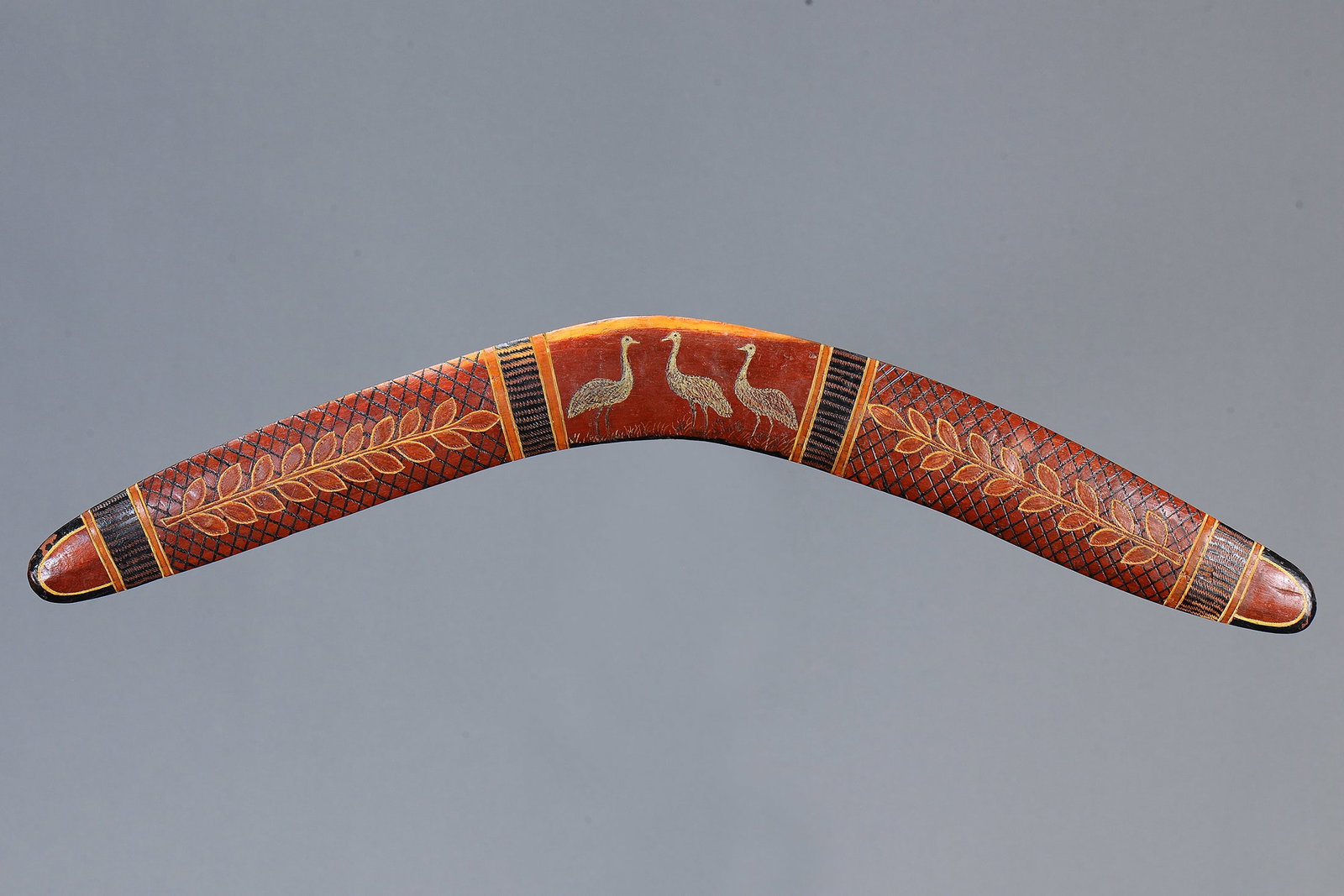 TRANSITIONAL BOOMERANG, MOWANJUM MISSION, WEST KIMBERLEY, WESTERN AUSTRALIA: Transitional Boomerang, Mowanjum mission, West Kimberley, western Australia. Carved and engraved hardwood and natural earth pigments. Size Approx L69 x 6.5cm. Medium Indigenous Artifacts Provenance