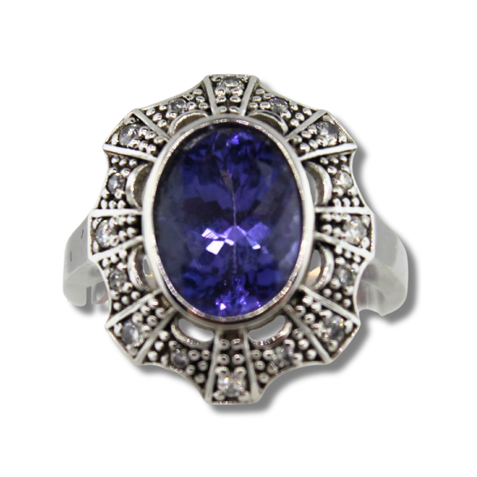 Large Tanzanite (5ct) surrounded by radiating small Diamonds and set in an 18ct Gold Ring (1 of 2)