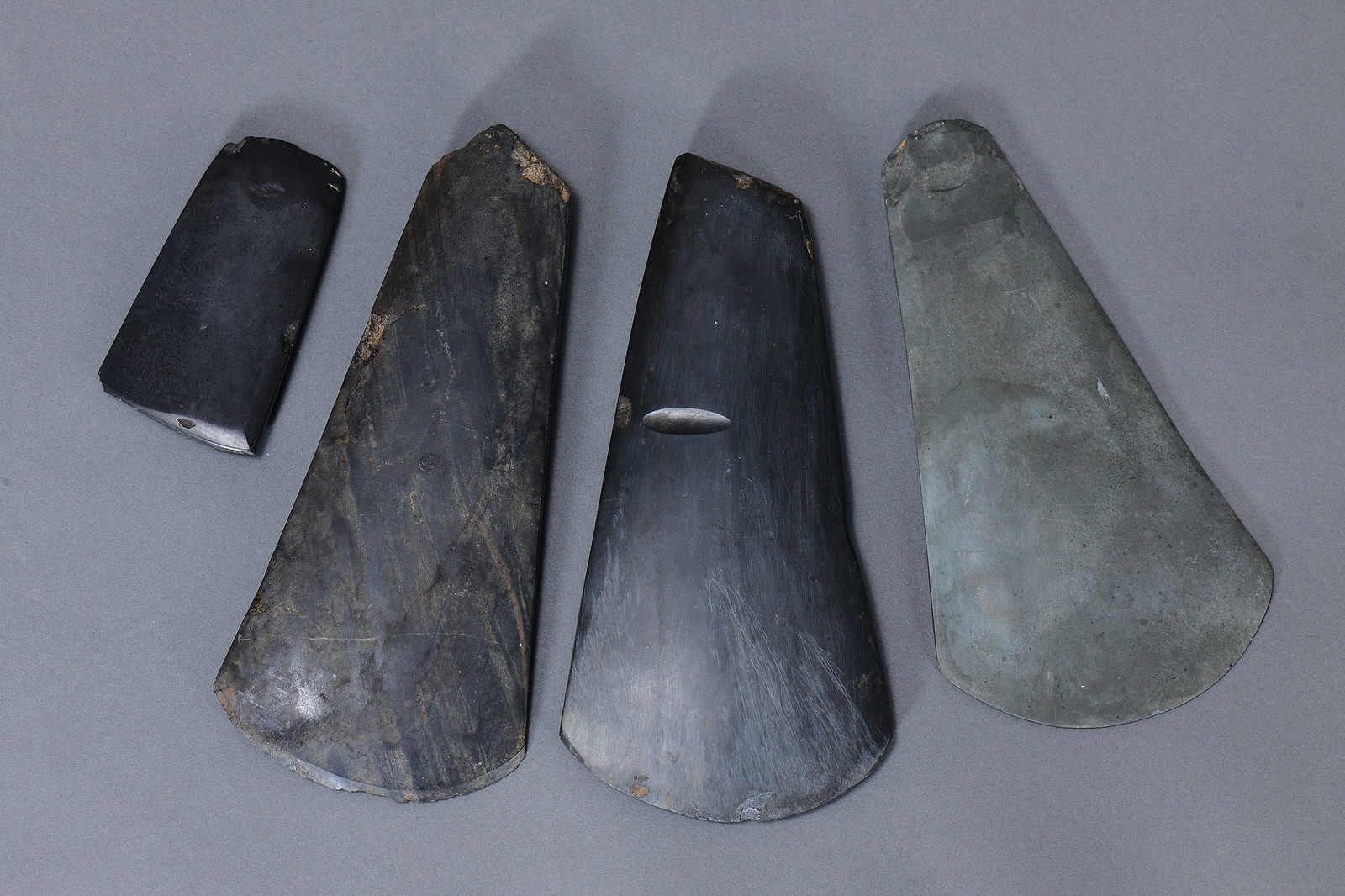 COLLECTION OF FOUR STONE AXE HEADS, MOUNT HAGEN, PAPUA NEW GUINEA (4 ITEMS) (1 of 2)