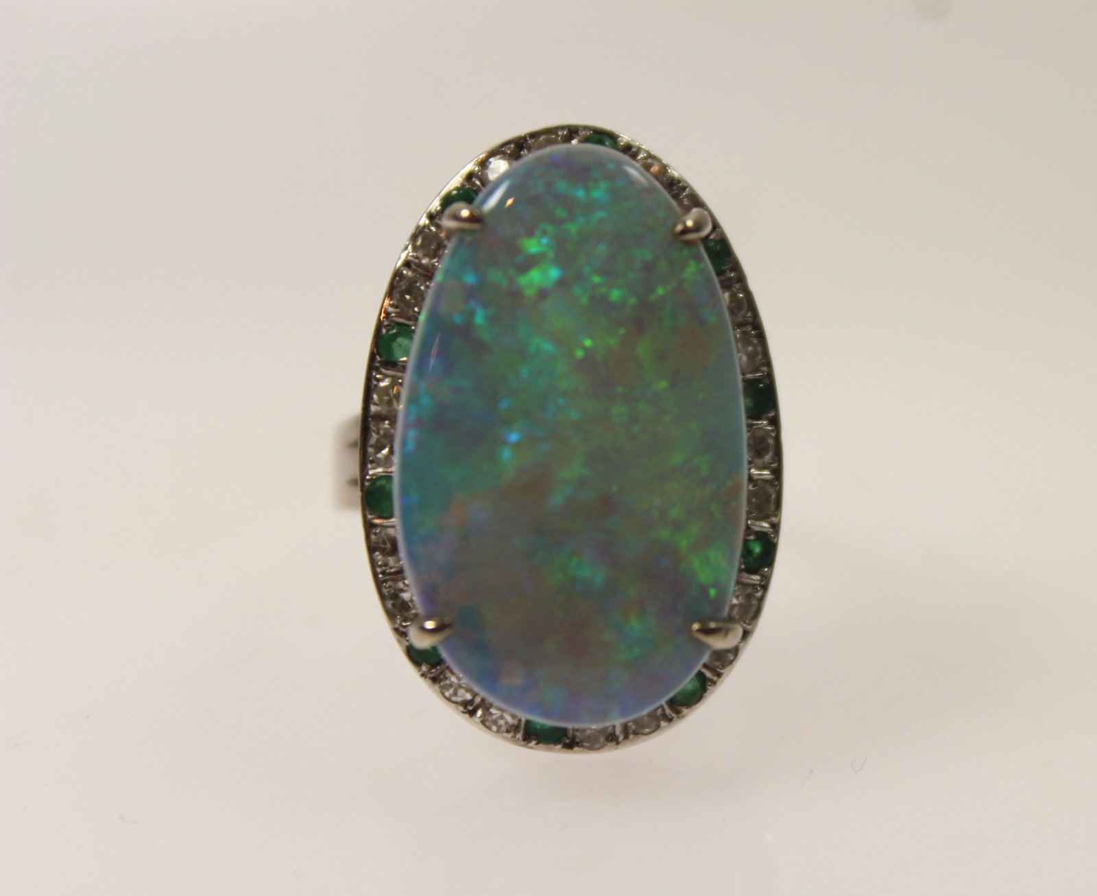 Solid Semi-Black Opal surrounded by a Halo of Diamonds & Emeralds in 14ct Yellow Gold Ring setting - 2