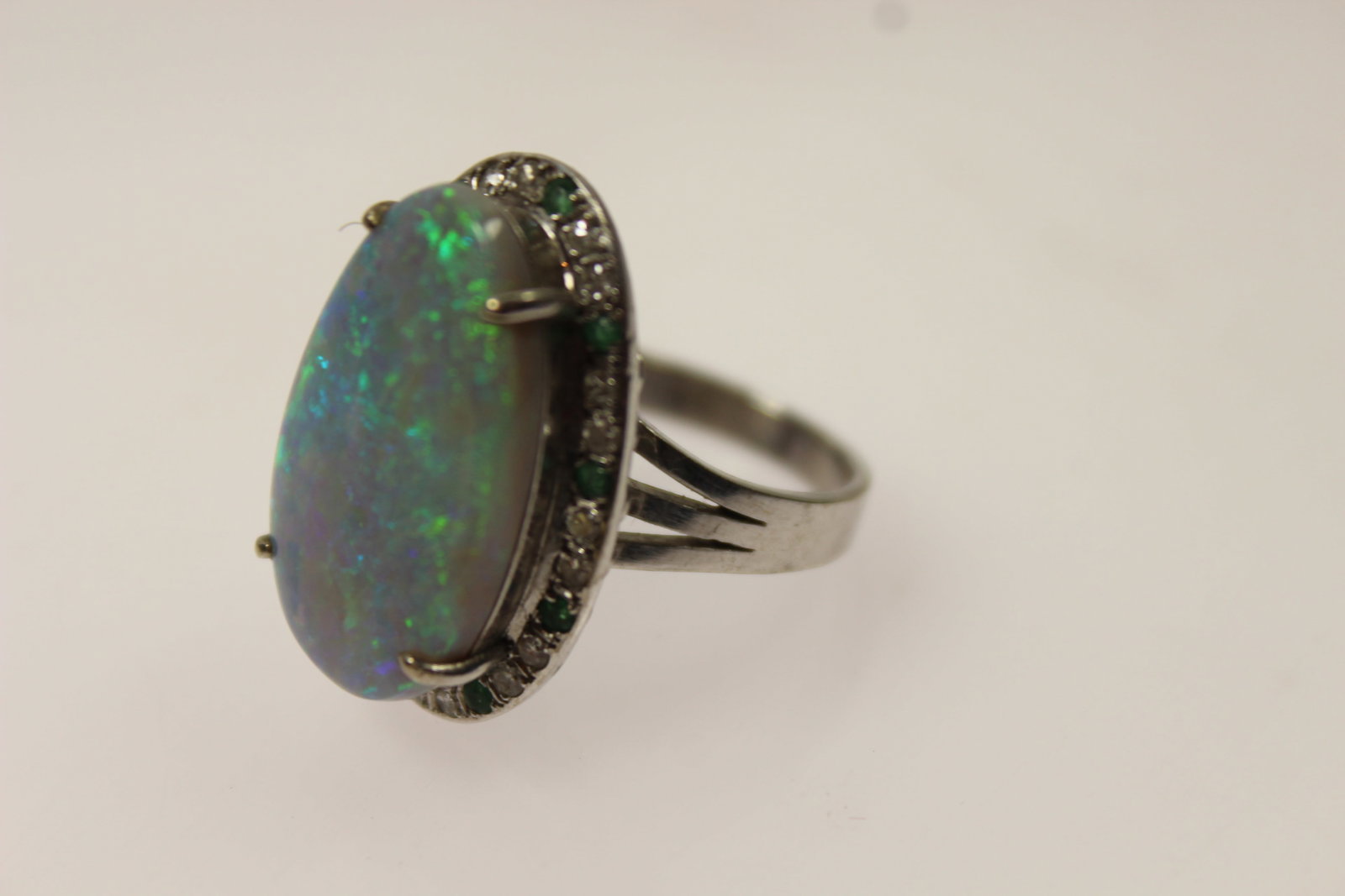 Solid Semi-Black Opal surrounded by a Halo of Diamonds & Emeralds in 14ct Yellow Gold Ring setting - 3