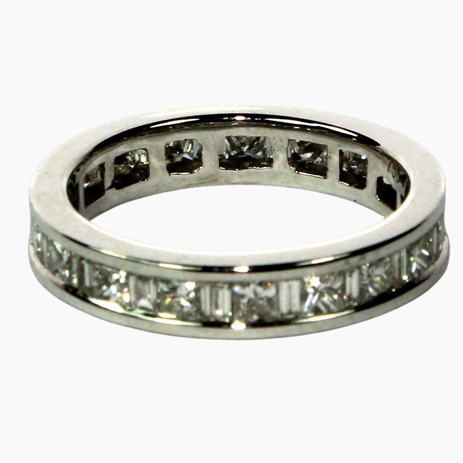 Eternity Ring in 18ct White Gold with channel set Princess & Baguette Diamonds: High quality & as new Size Size K : Total weight 3.75gms Medium Rings