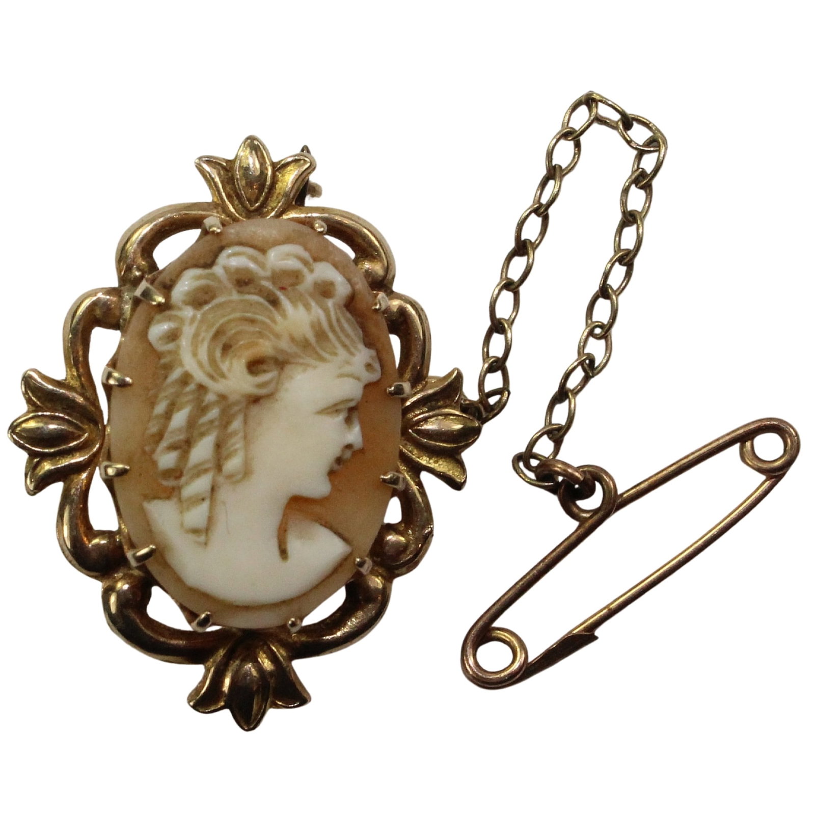 Antique Shell Cameo Brooch in 9ct Gold Surround: Ornate Size Dimensions 27x21mm : Total Weight 3.54gms Condition Base metal Pin & Safety Chain Medium Pins & Brooches