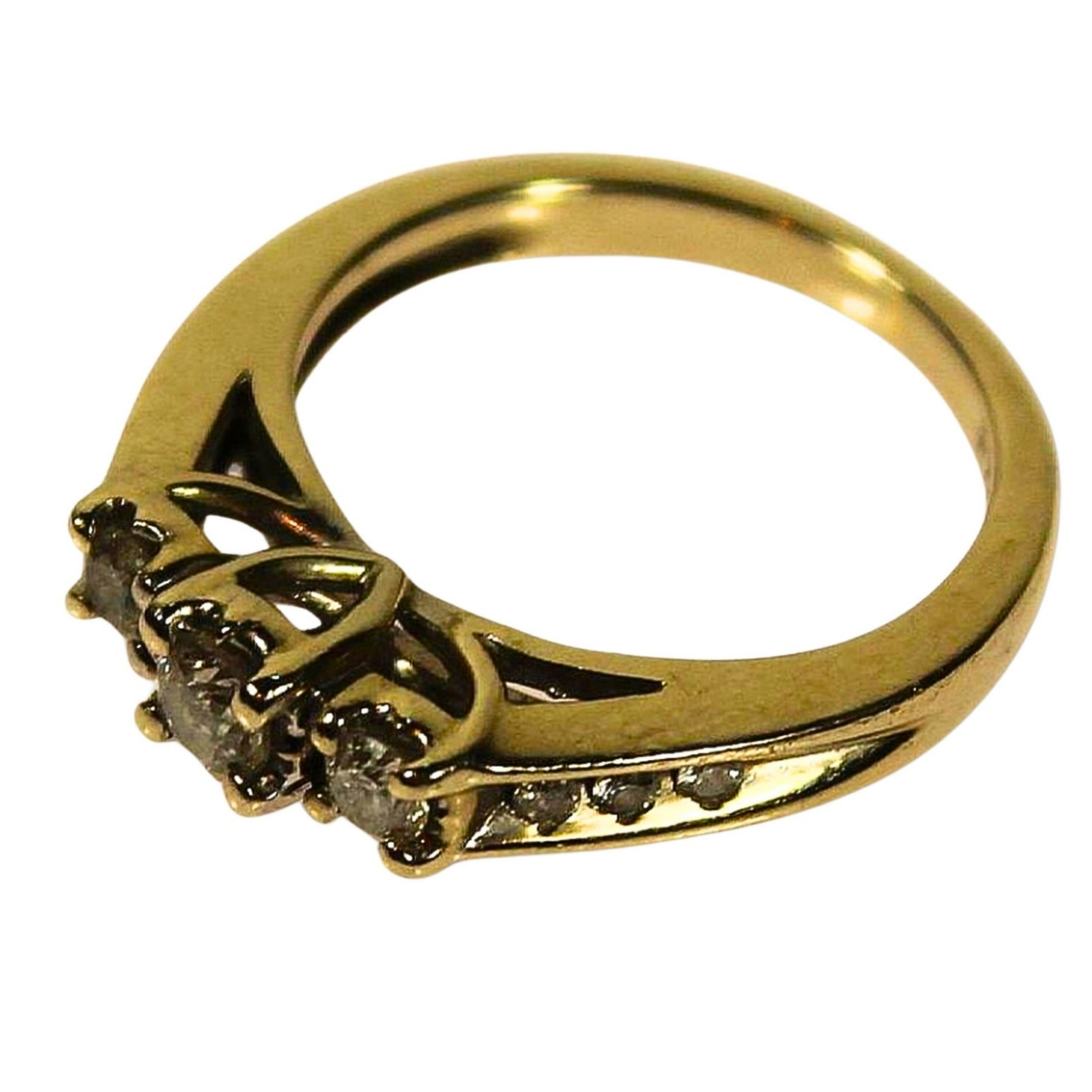 Diamond Ring in 14ct Yellow Gold: Three central Diamonds with six smaller Diamonds on the flanks Size Size K : Total weight 3.86gms Medium Rings Exhibited Diamond & Yellow Gold