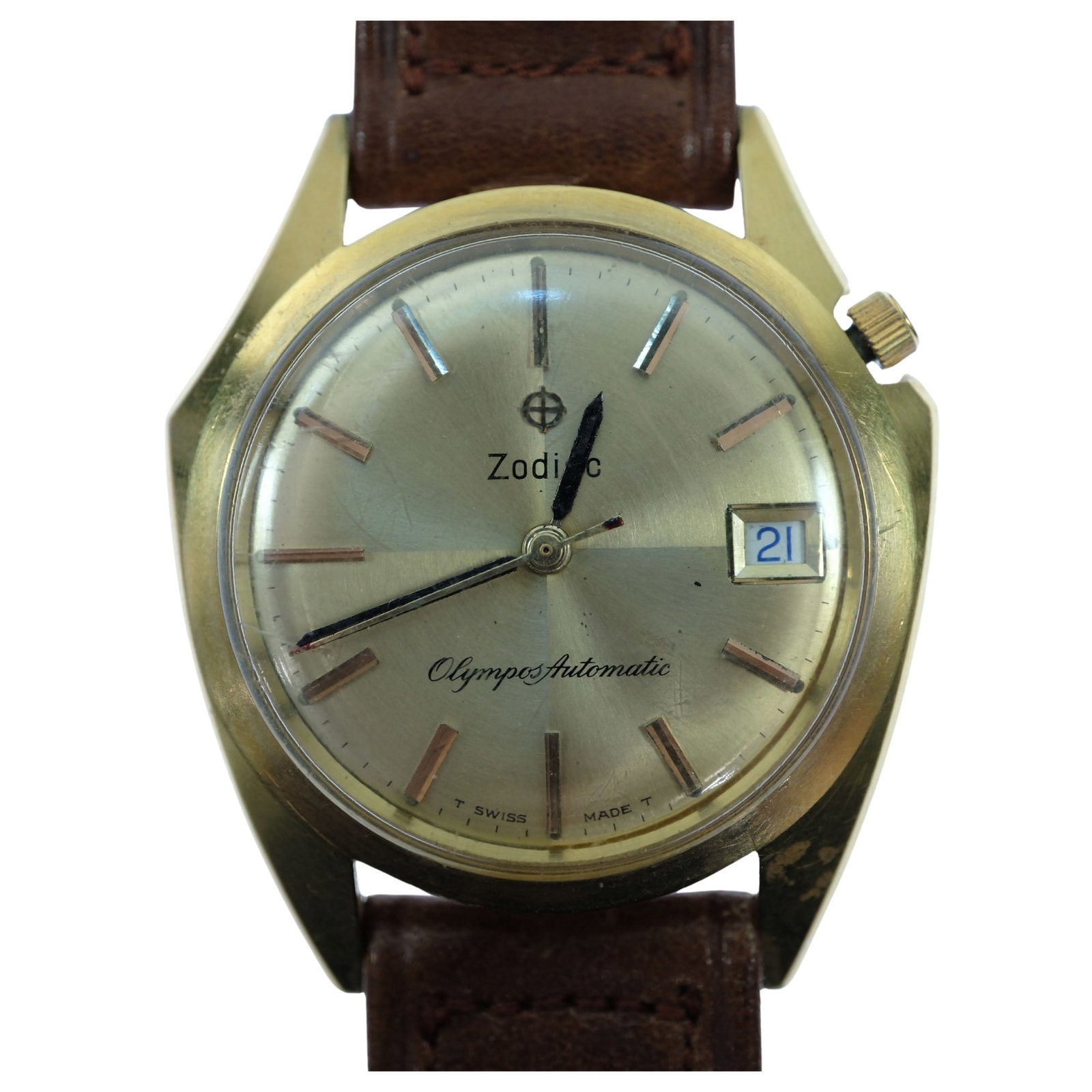 Vintage Men's Zodiac 'Olympos Automatic' Wristwatch with Gold Case & Quarter-sectioned Gold Dial: Date function. New Brown Leather Band Size Case approx 35mm Condition Automatic. Working. Hour & Minute hands show signs of corrosion. Loose back cover Medium Vintage