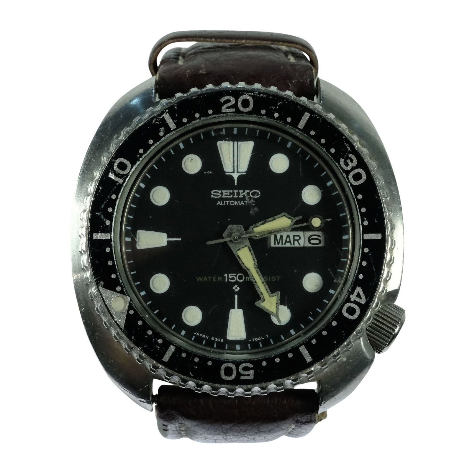 Vintage Men's Seiko 'Turtle Diver - 150m' Wristwatch with Silver Case & Black Dial: Model# 6309 - 7049. Day & Date Function. Dakota Stitched Leather Band Size Case approx 45m Condition Automatic. Working Medium Vintage