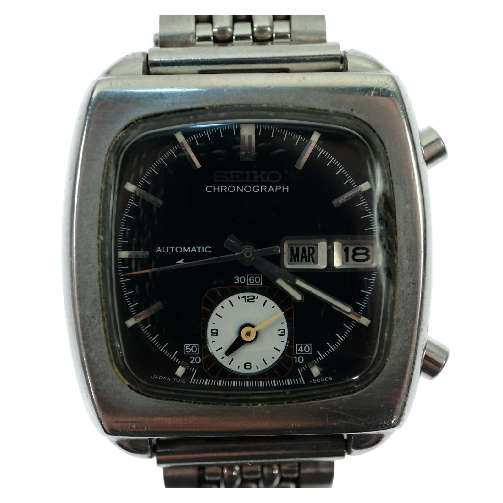 Vintage Men's Seiko 'Monaco' Chronograph with Silver Case & Black Dial: Model# 7016 - 5000. Day & Date Function. Metal Bracelet Band Size Case approx 35x35 Condition Automatic. Working Medium Vintage