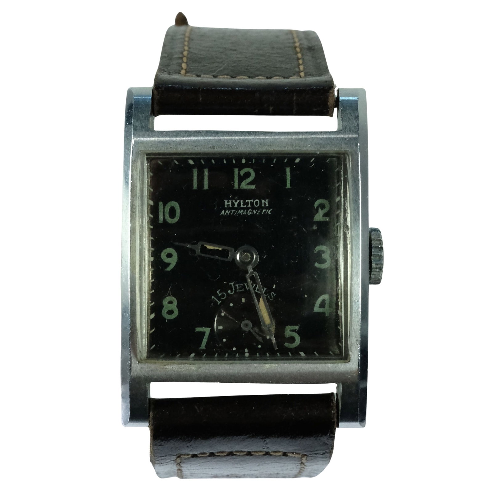 Vintage Men's Hylton Square Wristwatch with Silver Case & Black Dial: 15 Jewels. Second Dial New Leather Band Size Case approx 25x25mm Condition Mechanical. Working. Some losses from Fluorescent Hands Medium Vintage