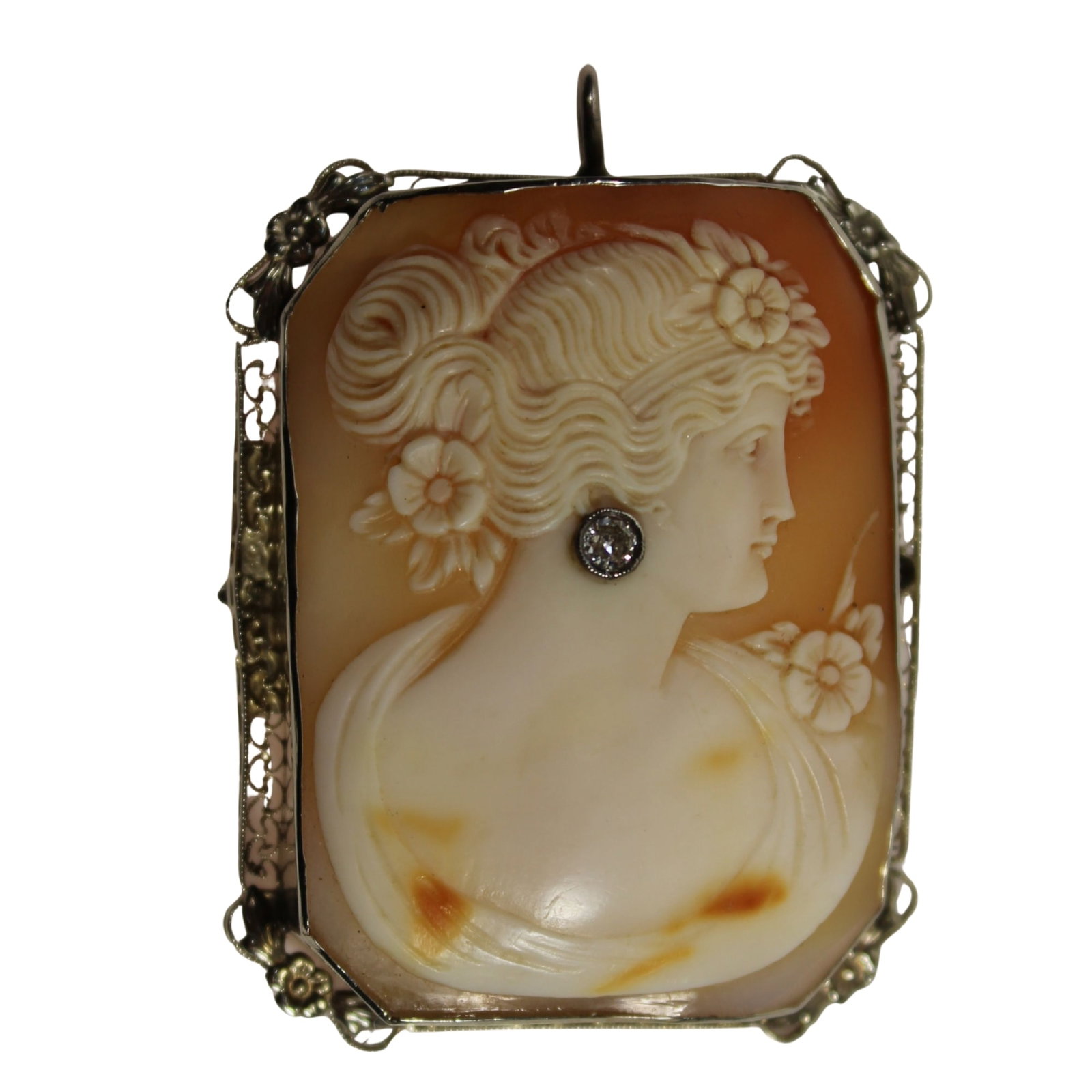 Shell Cameo of an Imperious Lady with Diamond-set Earring in 14ct White Gold Brooch / Pendant Mount: . Size Total weight 17.3gms. 5.5x4.5cms Medium Jewelry