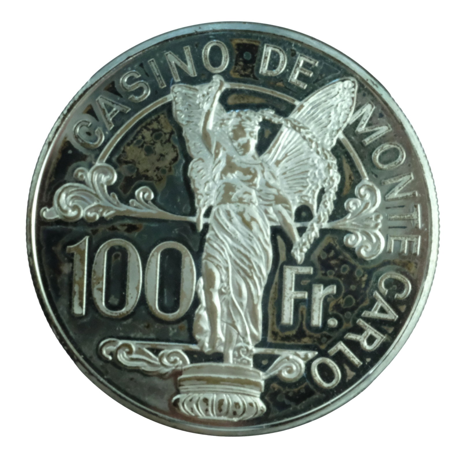 Monte Carlo Casino Silver (925) Proof 100 Franc Poker Chip about FDC: Circa 1979 Size Diameter 38 mm. ASW 0.6216 Troy oz Condition Some patchy toning