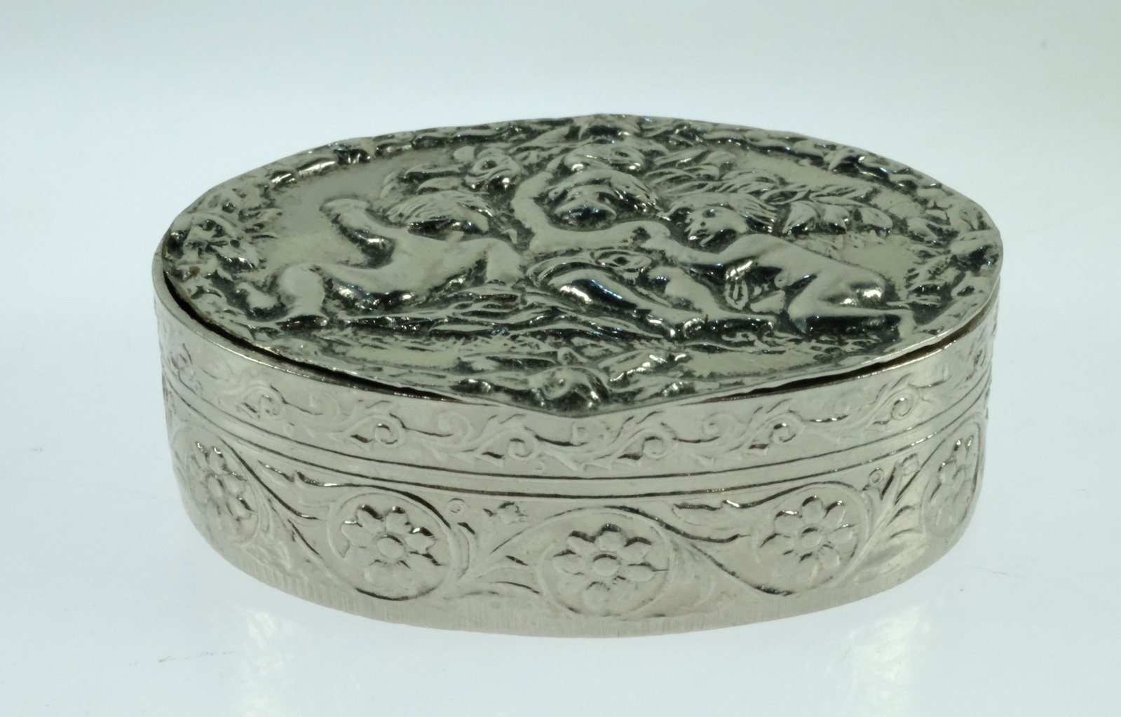 Vintage Silver-plate Hinged-top Oval Pill Box with pressed Cherub design - 2