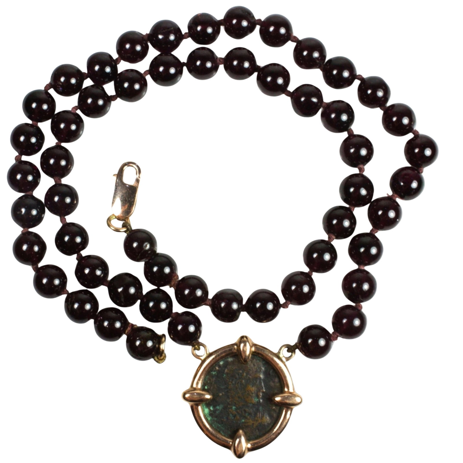 Bespoke Garnet Necklace supporting a Roman Ae Bronze Coin in 9ct Yellow Gold Surround: Clasp is also 9ct Yellow Gold Size Open length 42cms Medium Jewelry Exhibited General