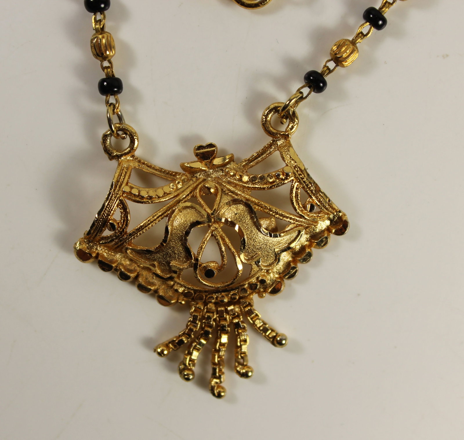 Intricate Asian-style Gold-finished Necklace interspersed with Black Glass Beads - 2