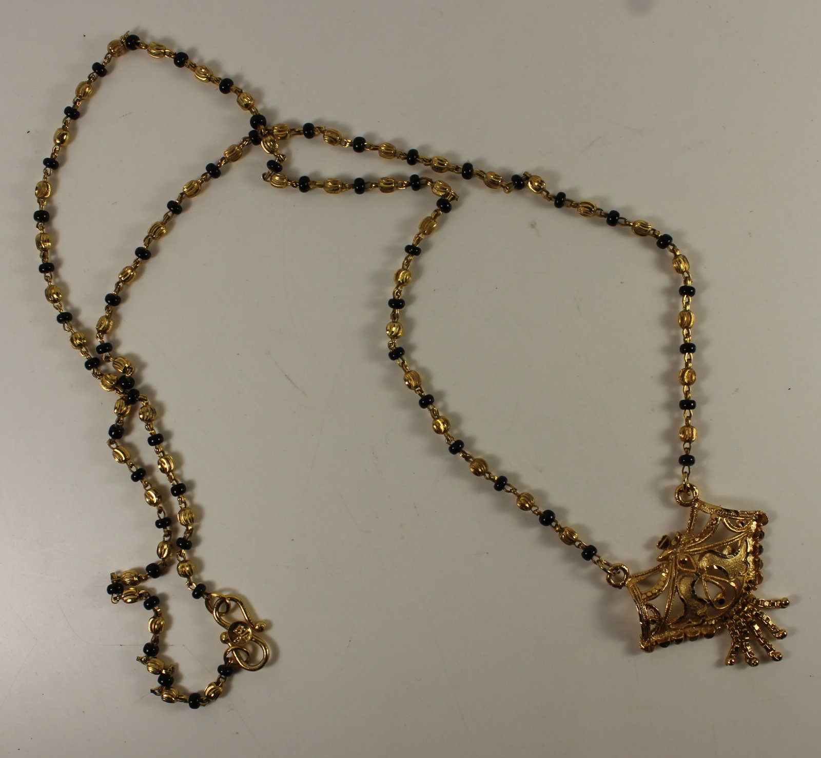 Intricate Asian-style Gold-finished Necklace interspersed with Black Glass Beads - 3