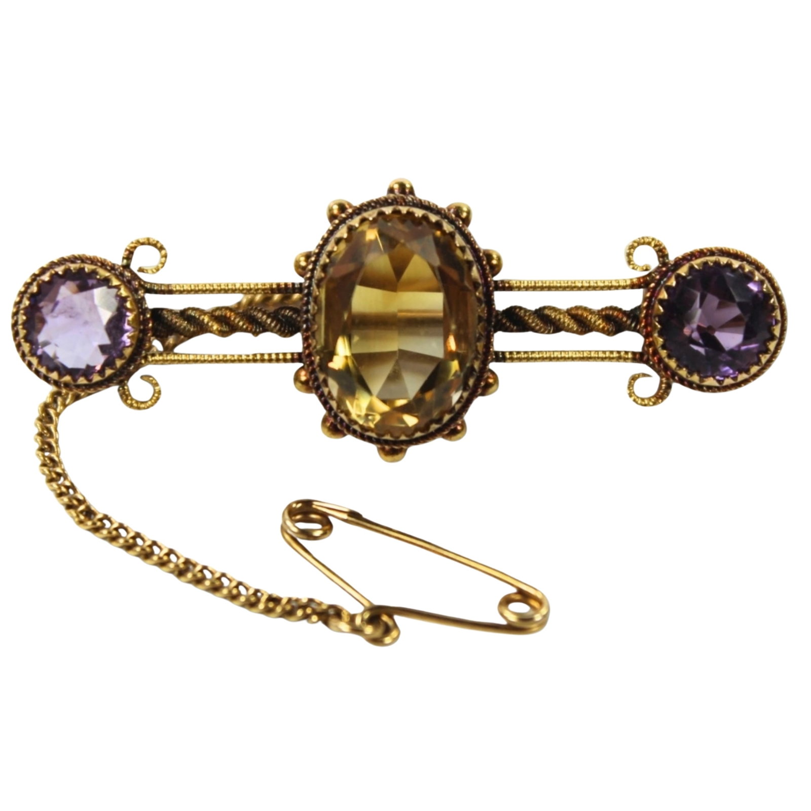 Stunning Edwardian-style Brooch stamped 15ct with Central Citrine flanked by two Amethysts: Tests 22ct Size Total weight 4.87gms : Length 4cms Condition Safety chain 9ct Medium Jewelry