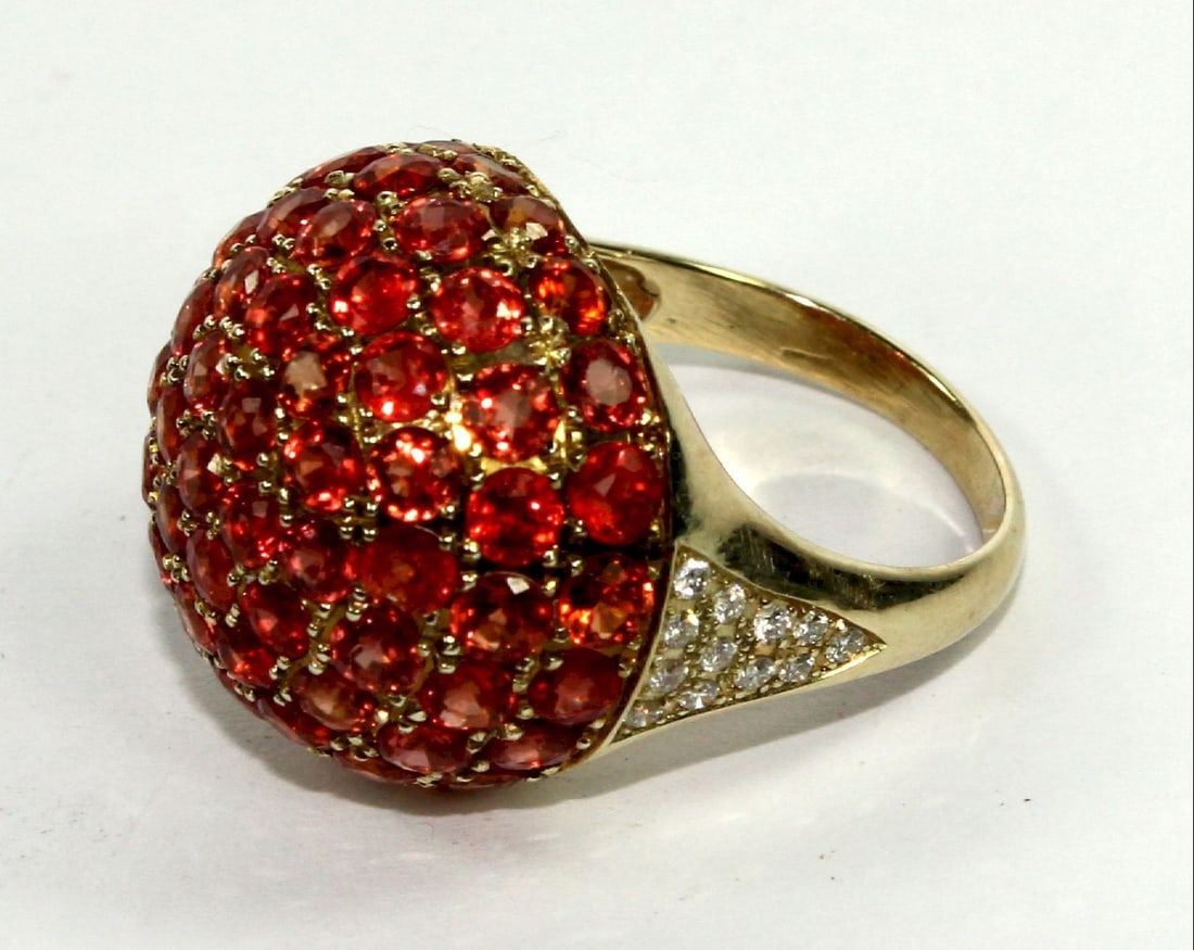 Red Sapphire & Diamond Cocktail Ring in 9ct Yellow Gold: Domed Micro-set Rubies flanked by a mosaic of small Diamonds Size Size M :Total weight 6.92gms Medium Jewelry