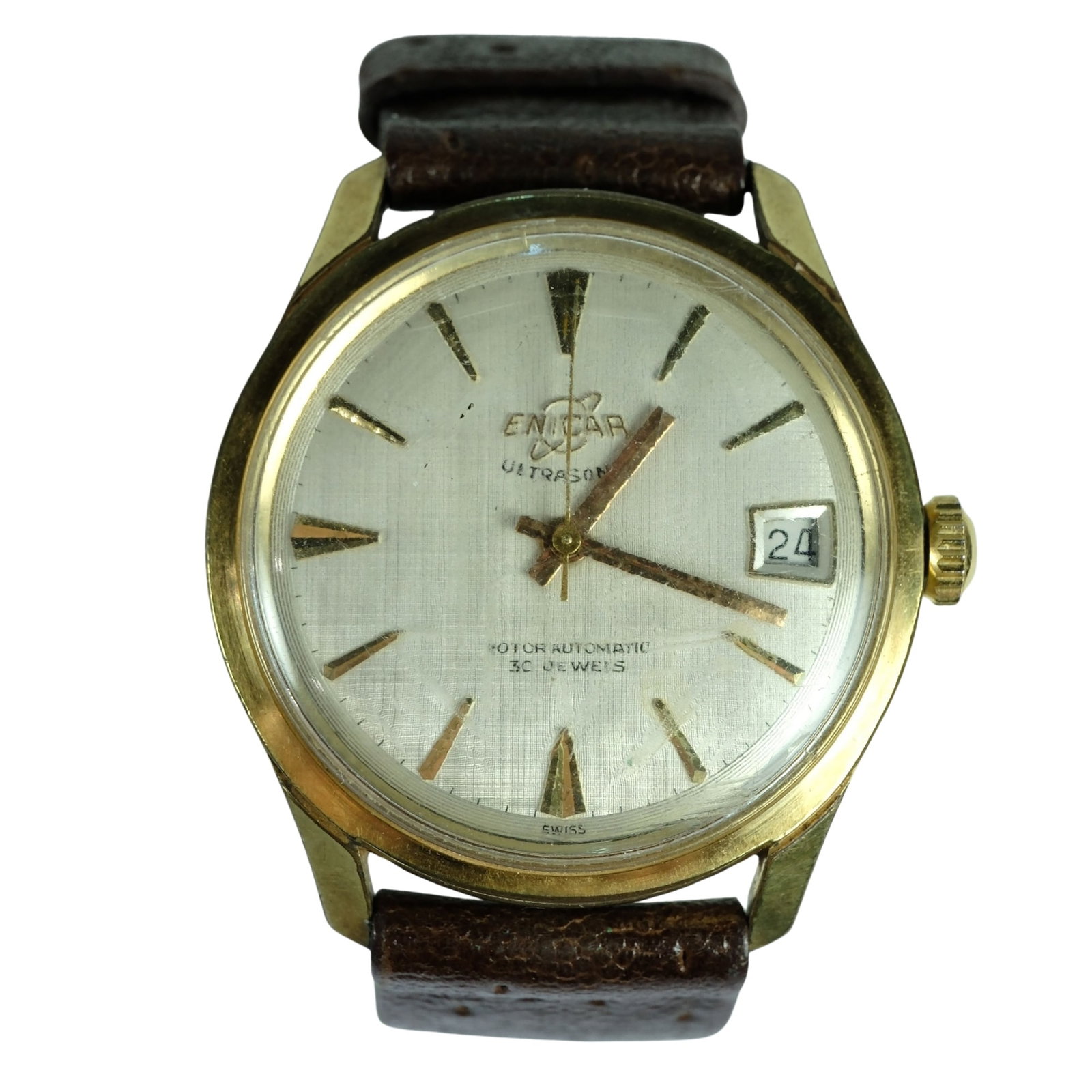 Vintage Men's Enicar 'Ultrasonic - Rotor Automatic' Gold Case Wrist Watch with Silver Dial: Model# 125 / 001. Date Function. New Leather Band Size Case approx 34mm Condition Automatic. Working. Glass is heavily scuffed and needs replacing. Reverse is engraved with indecipherable name &