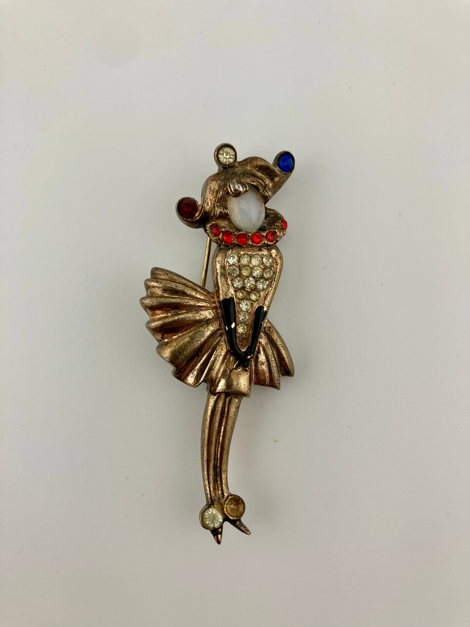 Urie Mandle Brooch Sterling Vermeil Figural Dancer: Vintage Urie Mandel Brooch. Unsigned. Sterling Vermeil. Figural dancer with Cabochon and pave stones. One stone missing from the shoe. Measures 2.5" x 1"