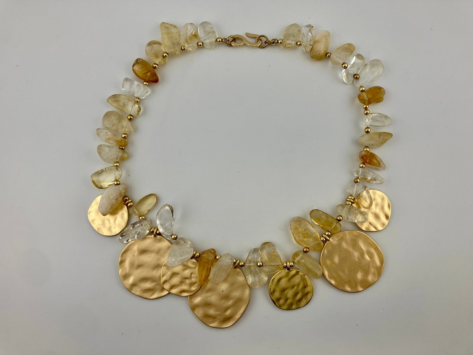 Kenneth Lane Hammered Gold and Topaz Necklace: Kenneth Lane Hammered Gold and Topaz Necklace. 17" long and 1.5" drop.