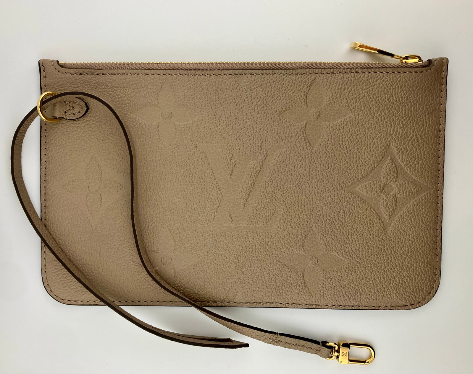 Louis Vuitton Compact Clutch - Turtledove Empreinte Monogram Leather: Clutch has never been used and measures 10" wide, 6" tall, and .25" thick.