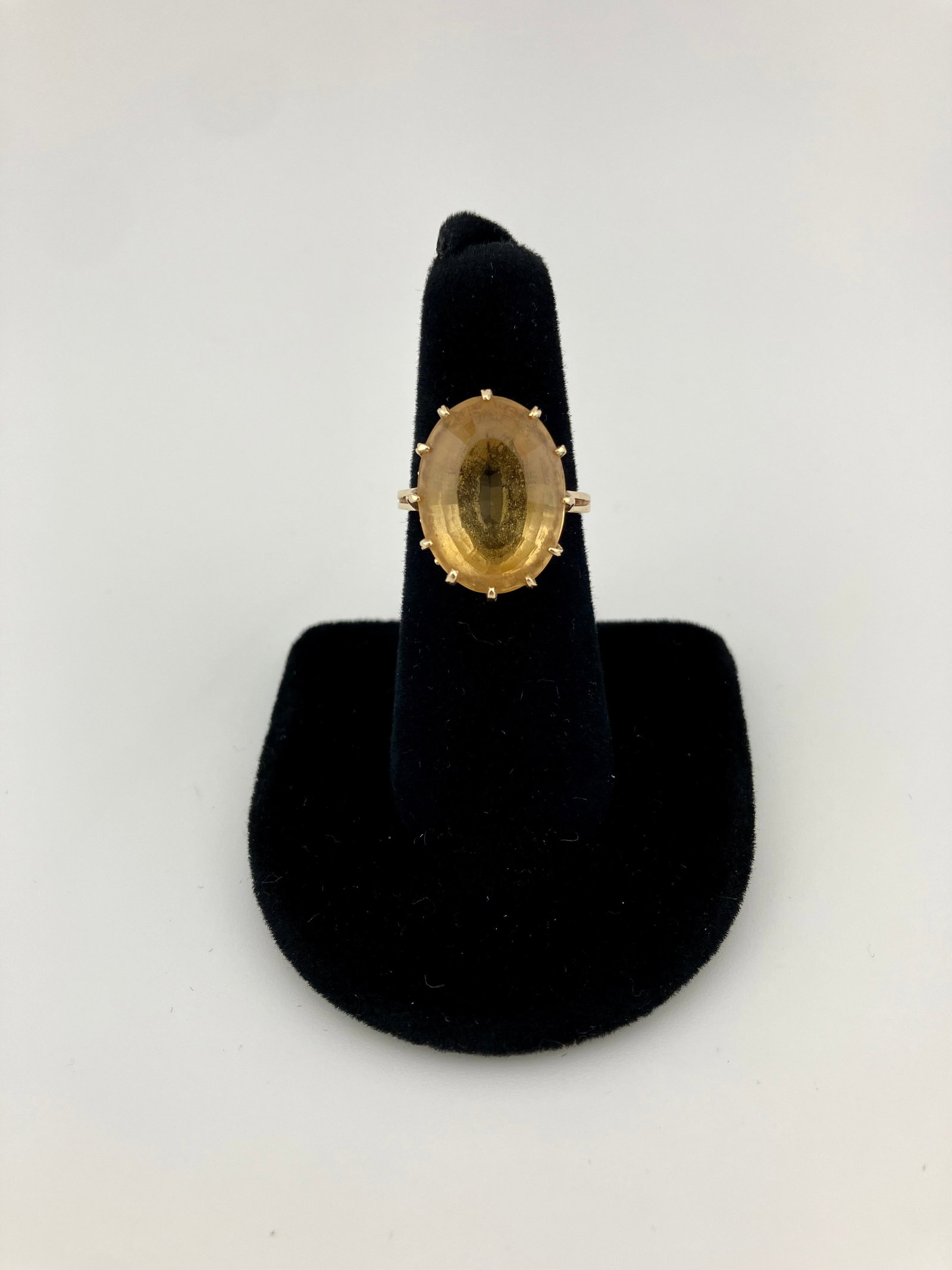14k Gold Ring with Citrine: Ring consists of one oval-cut citrine measuring 18mm x 13mm. The ring size is 6.5