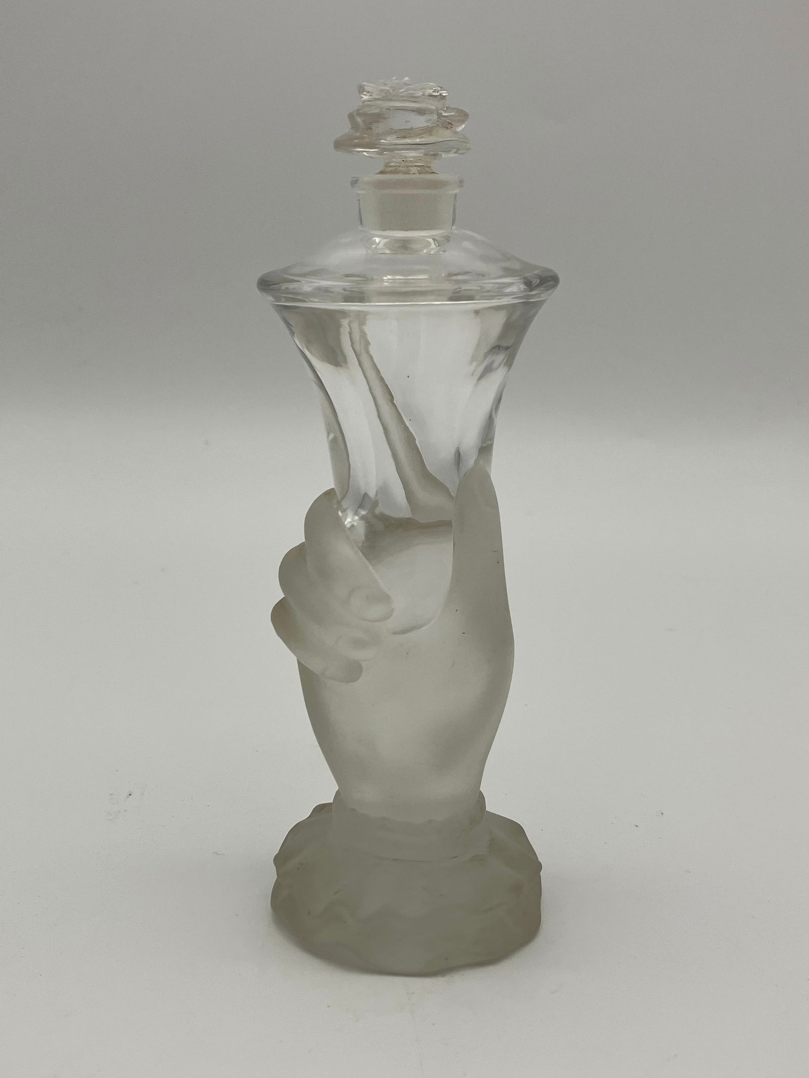 Baccarat Crystal Frosted Hand Perfume Bottle: Baccarat 20th C crystal perfume bottle. Frosted hand with rose stopper. 6x2.25"