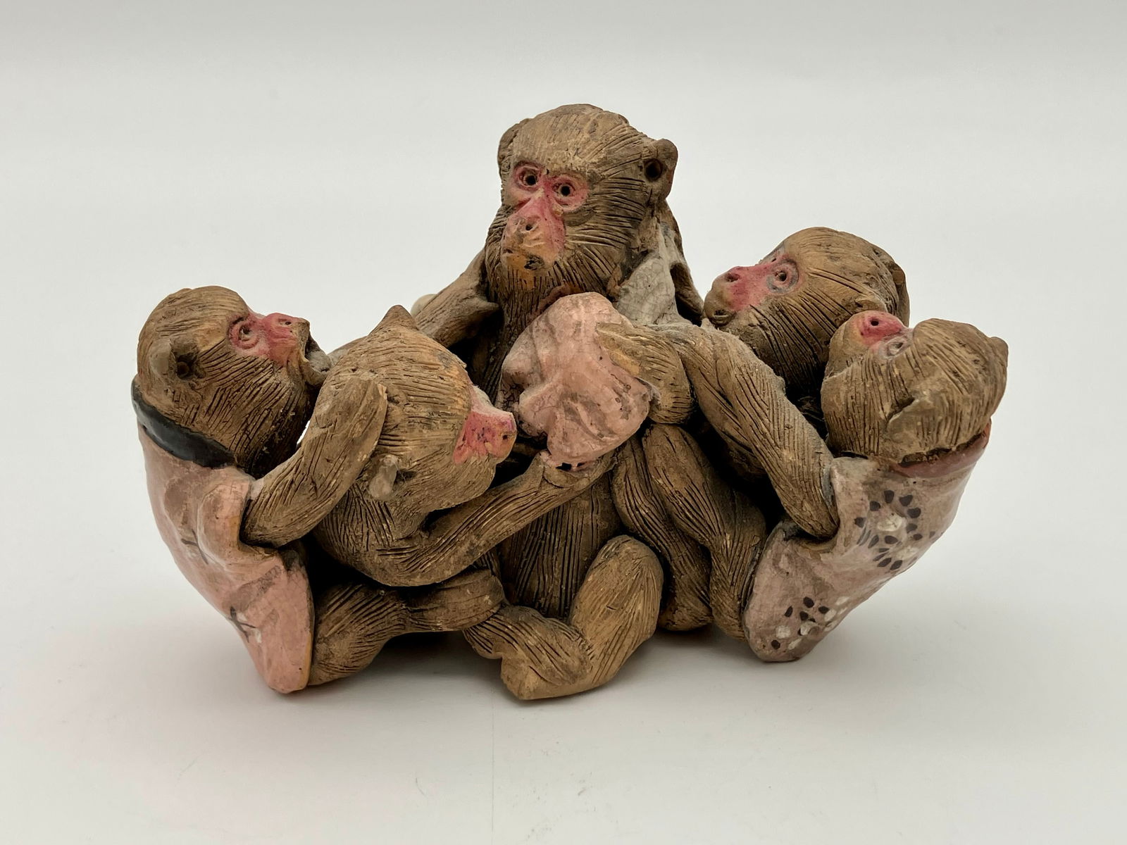 Japanese Pottery Sumida Monkey Figurine: Group of Sumida monkeys with shirts. Unmarked.