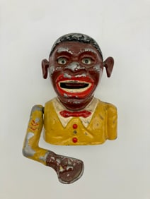 Jolly Black Man with a Yellow Shirt Mechanical Bank