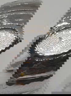 Roberto Cavalli Watch - New Wrapped with Box: Working condition the Roberto Cavalli R7253133615, a watch that epitomizes luxury and sophistication. Its silver-tone oval dial, adorned with shimmering rhinestones, exudes a refined elegance that per